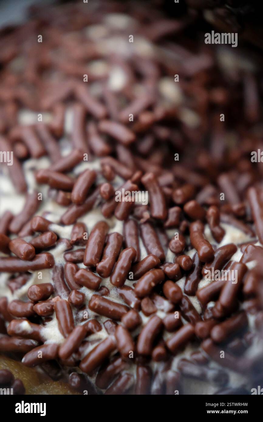 Close-up of chocolate sprinkle on a donut. Stock Photo