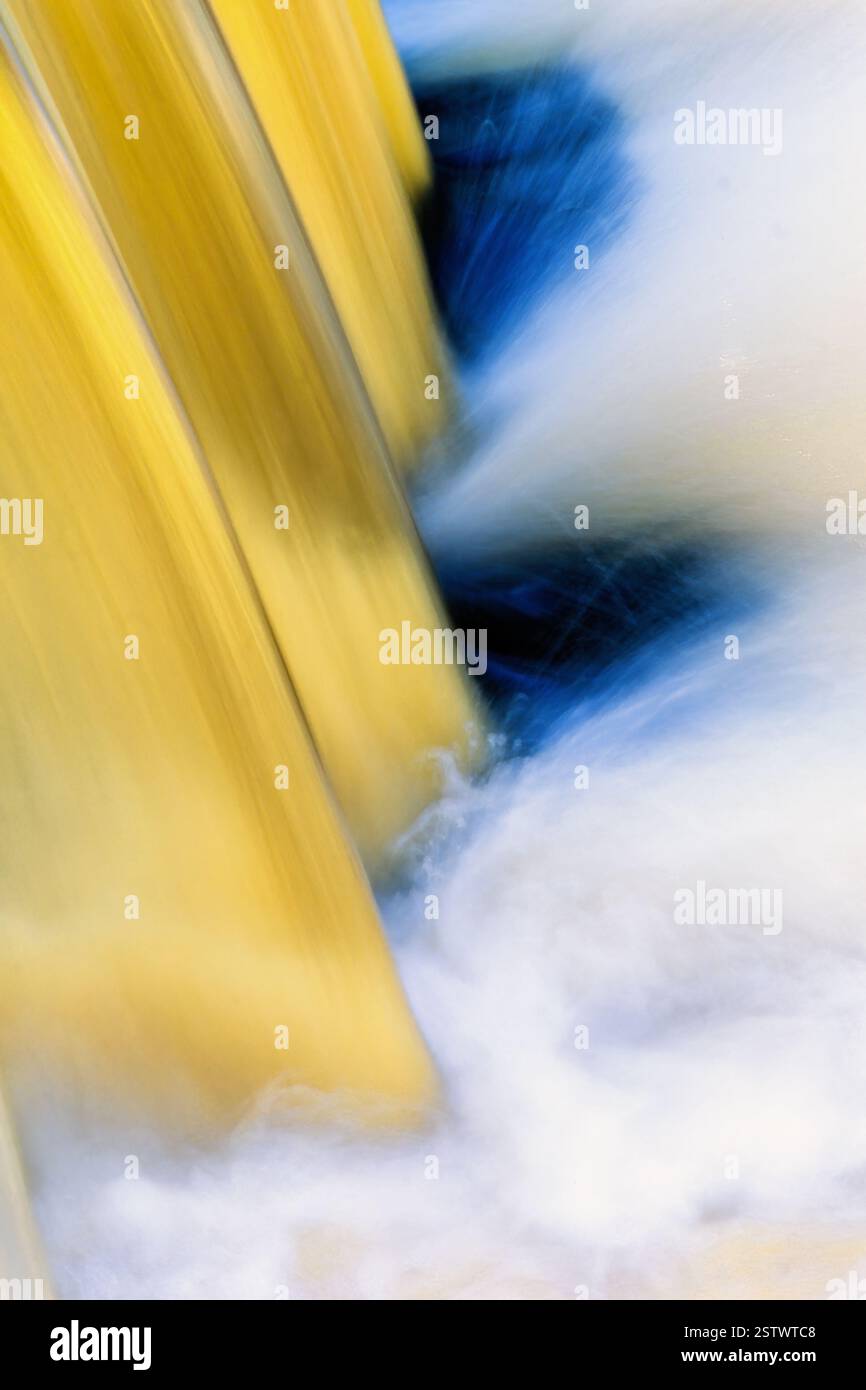 Blurred water in a waterfall in a river Stock Photo