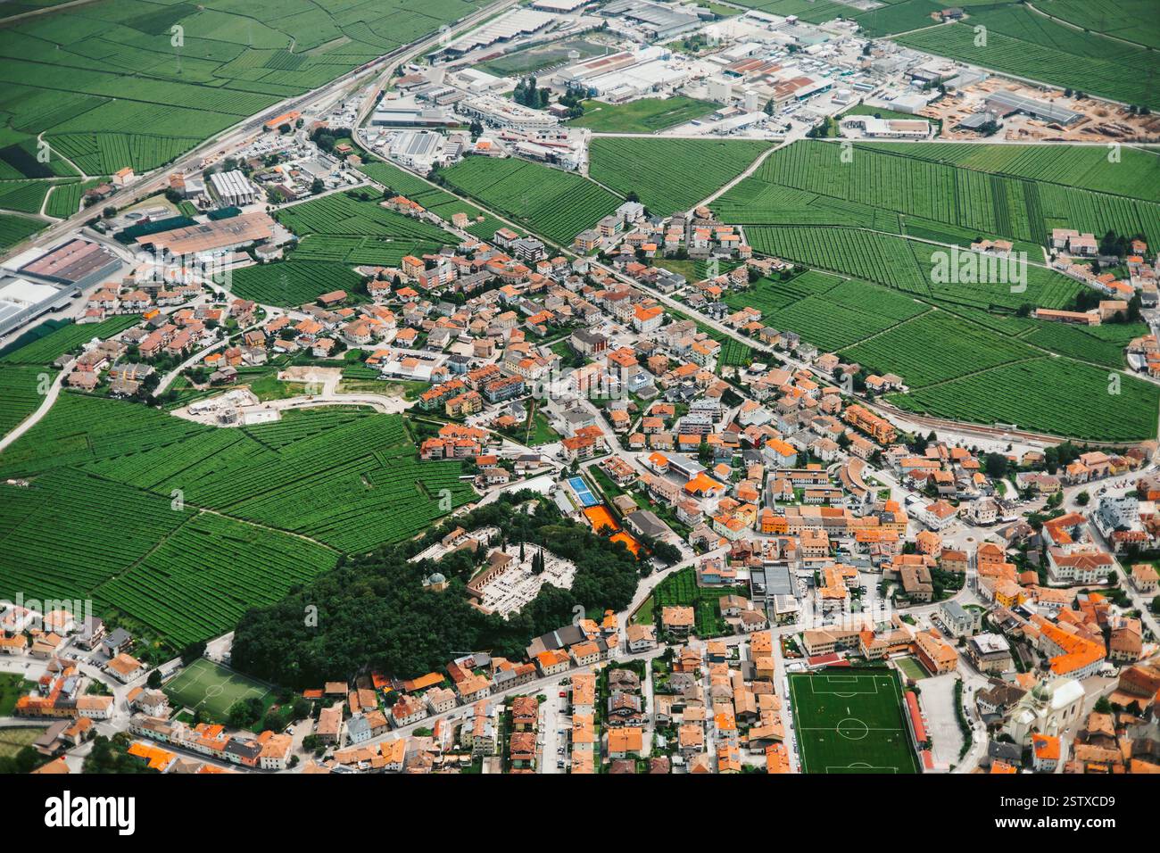 Top view of a small town in northern Italy. Small town at the foot of the mountains. Stock Photo
