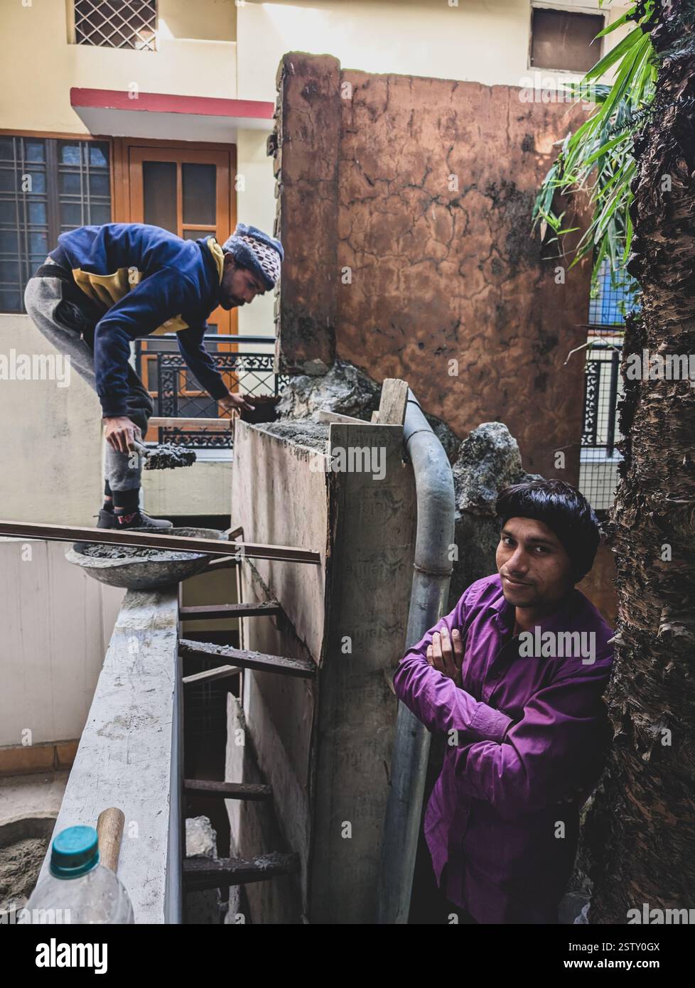 View of Feb15th2025 Dehradun Uttarakhand India. Skilled laborers pile bricks on ...
