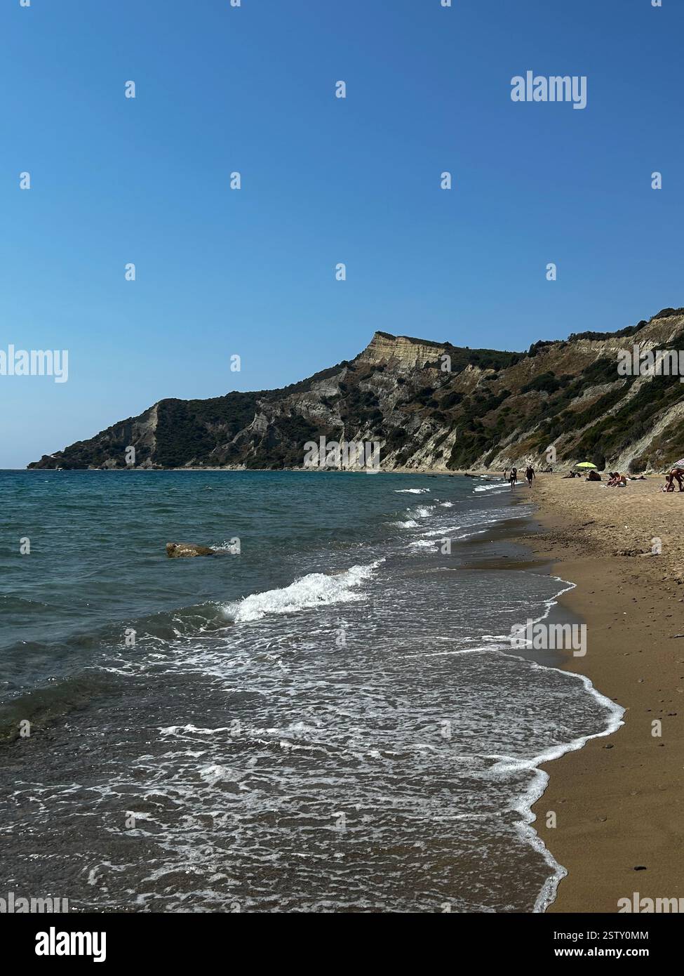 Where the Waves Kiss the Cliffs – A Beachside Escape - Smartphone Captured Stock Image