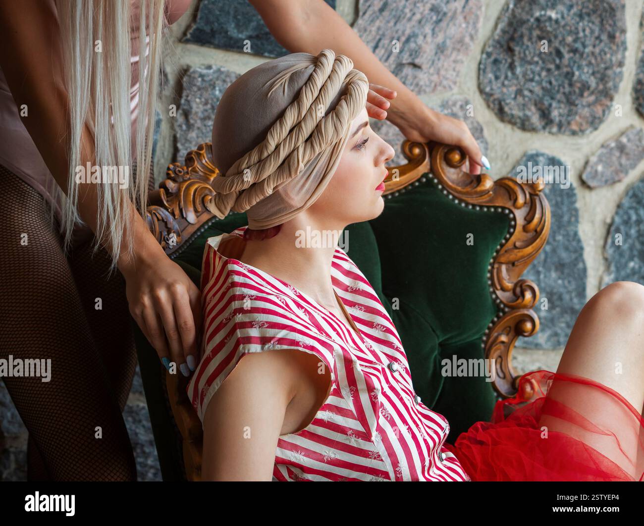 Amidst a rustic setting, a chic model showcases a stunning vintage look ...