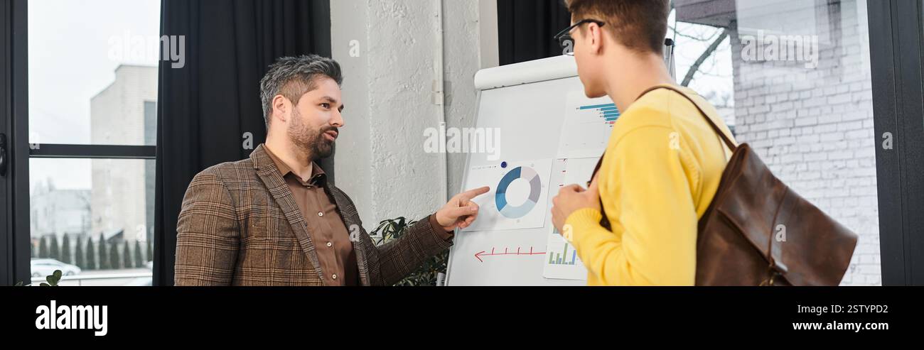 Two colleagues discuss charts and insights during a welcoming ...