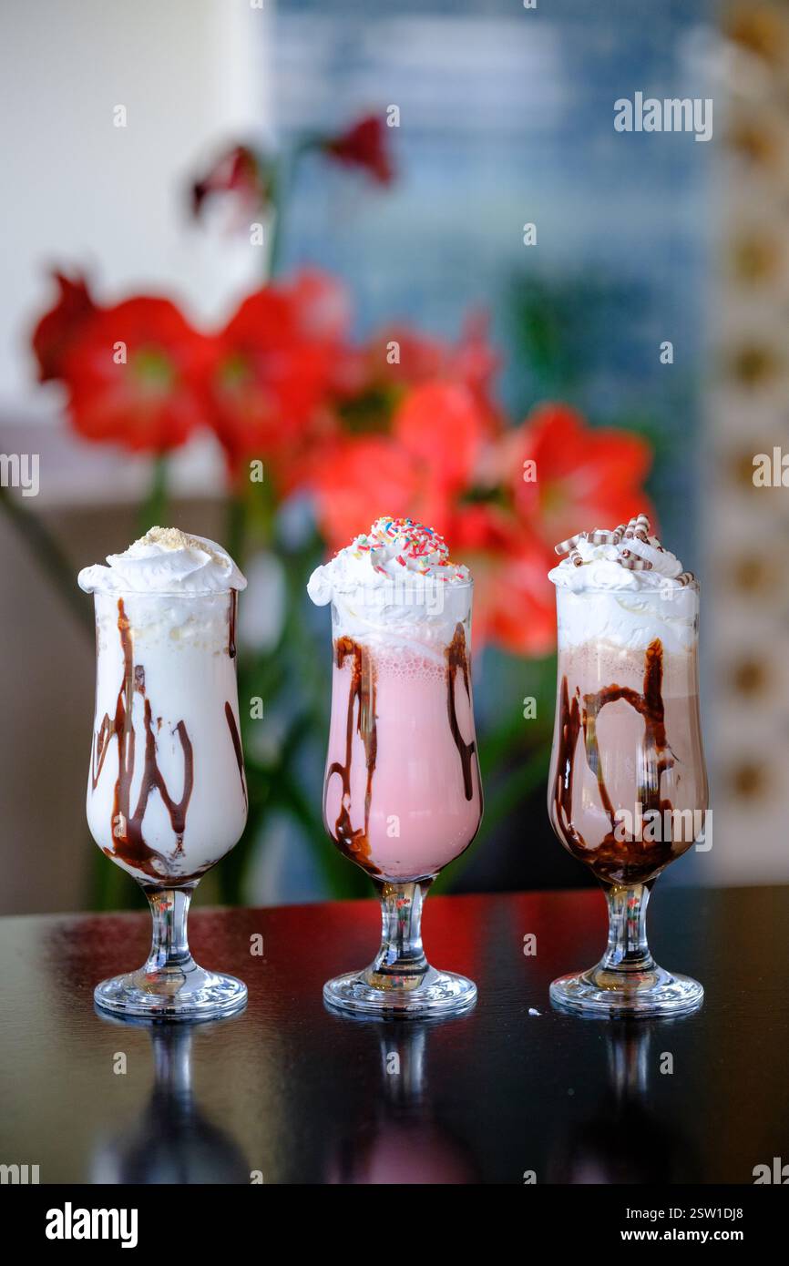 Three creamy milkshake variations: chocolate strawberry and vanilla ...