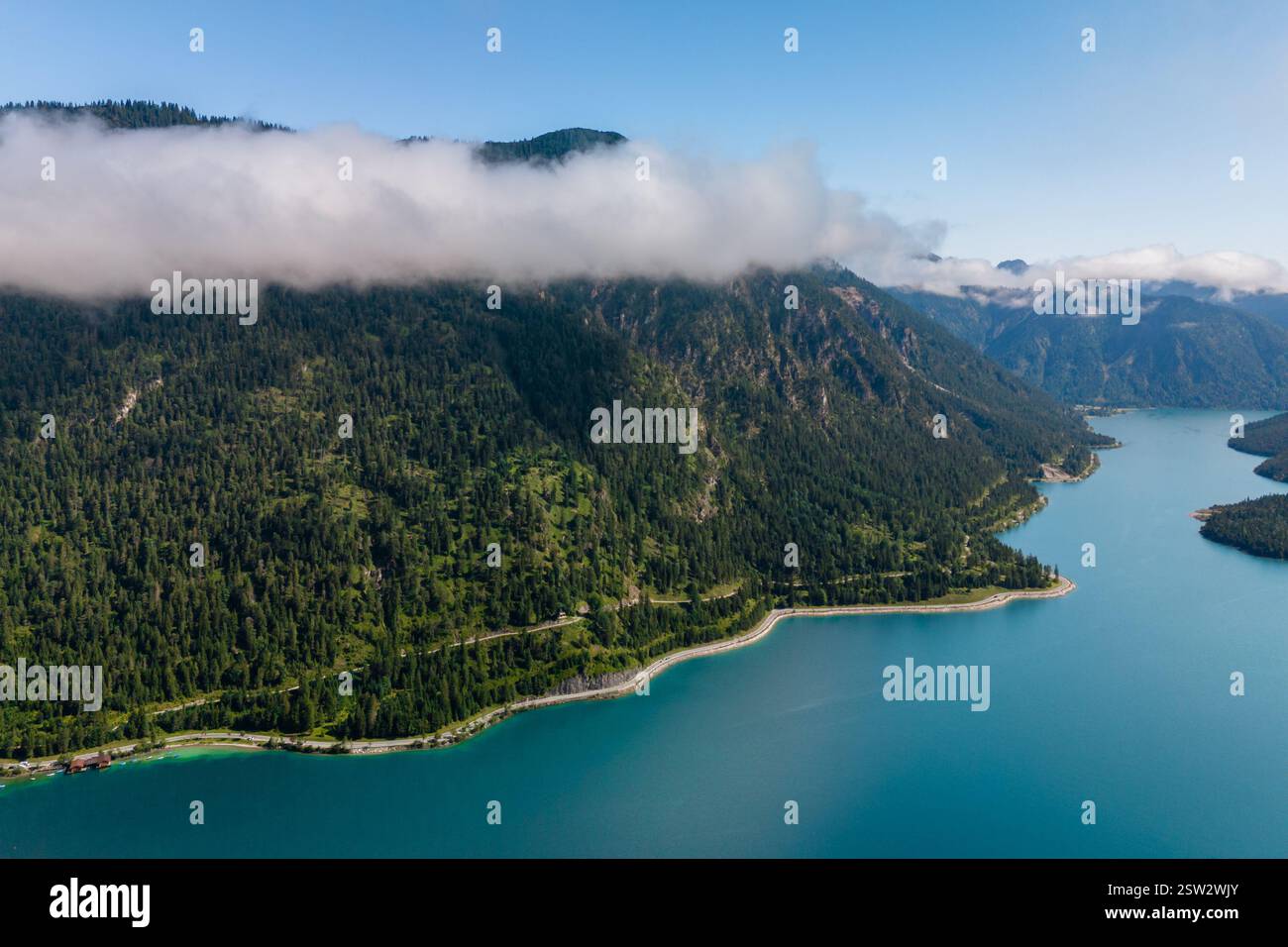 Serene morning mist over Plansee lake in the Austrian Alps Stock Photo