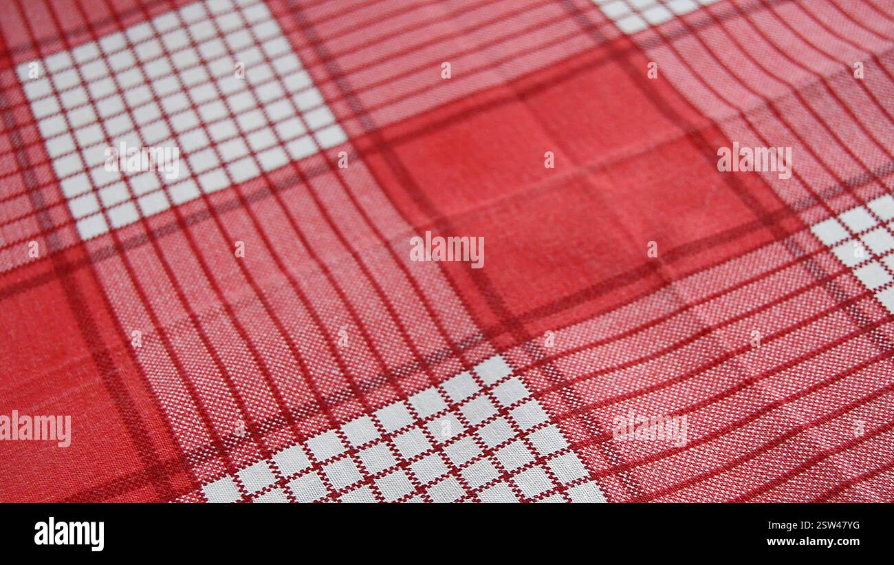 red checkered fabric background, close-up, selective focus Stock Photo