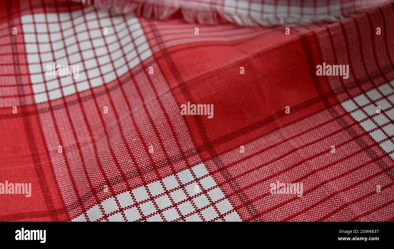 red checkered fabric background, close-up, selective focus Stock Photo