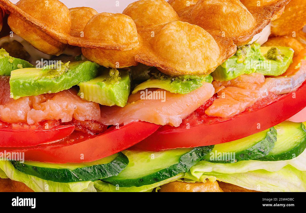 Belgian waffles with salmon and avocado close up Stock Photo