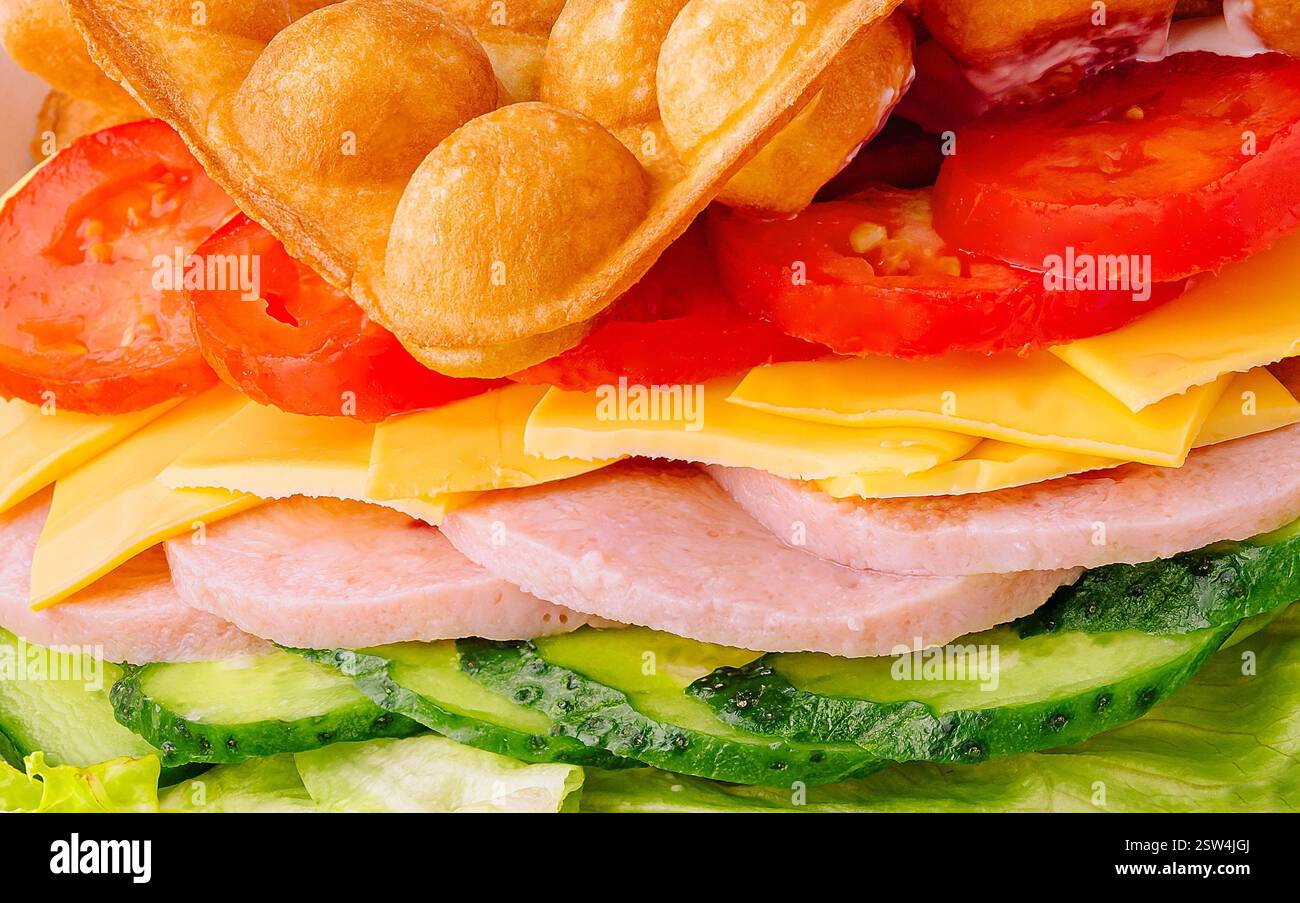 Belgian waffles with ham, cheese and salad close up Stock Photo