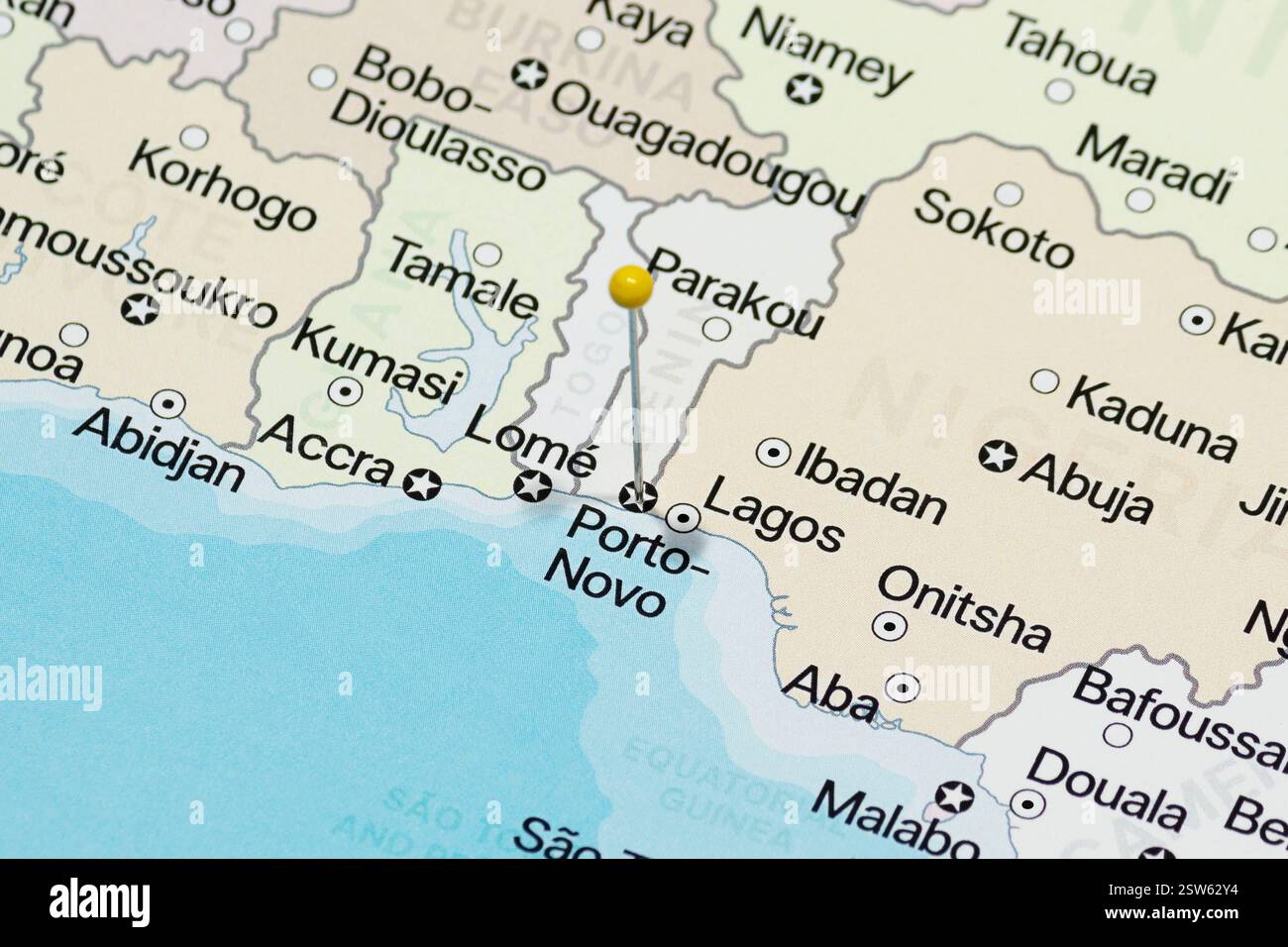 yellow pin needle into porto novo city of benin political map Stock Photo