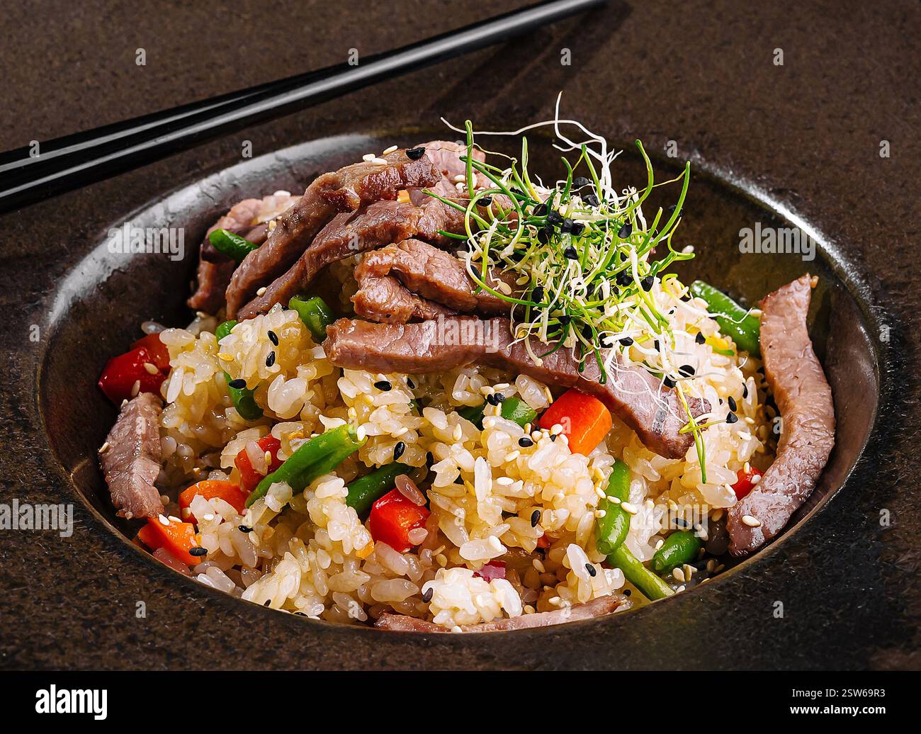 Delectable asian beef fried rice in elegant presentation Stock Photo ...