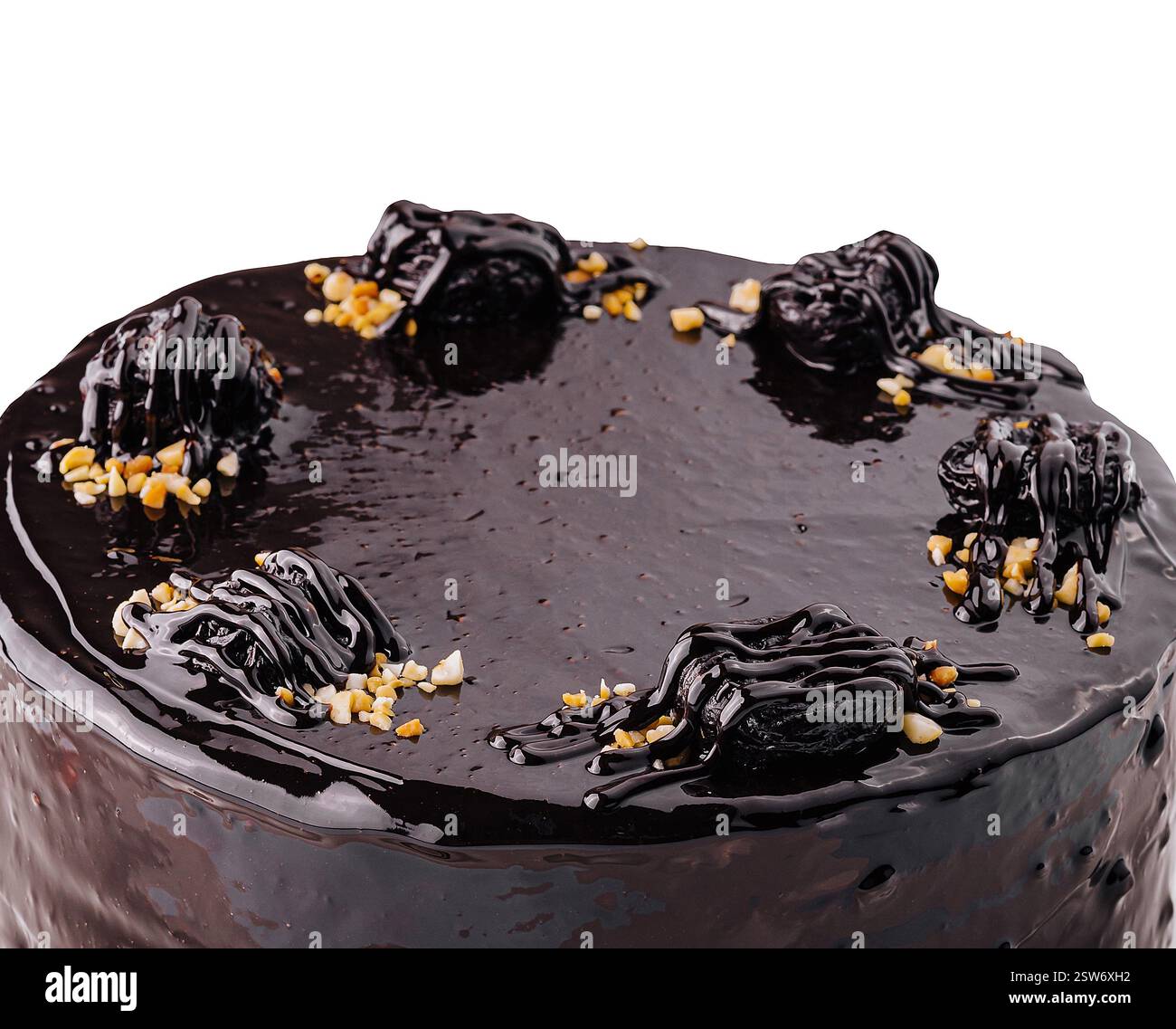 Decadent chocolate ganache cake on white plate Stock Photo