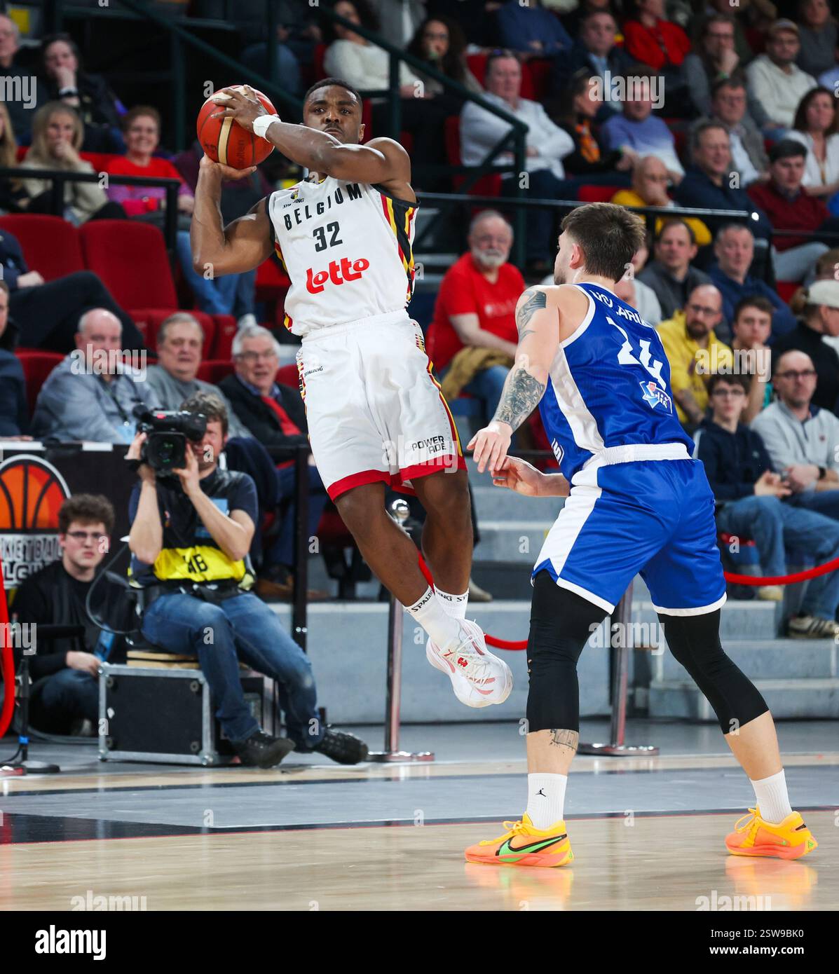 Belgium's Retin Obasohan and Slovak Samuel Volarik fight for the ball