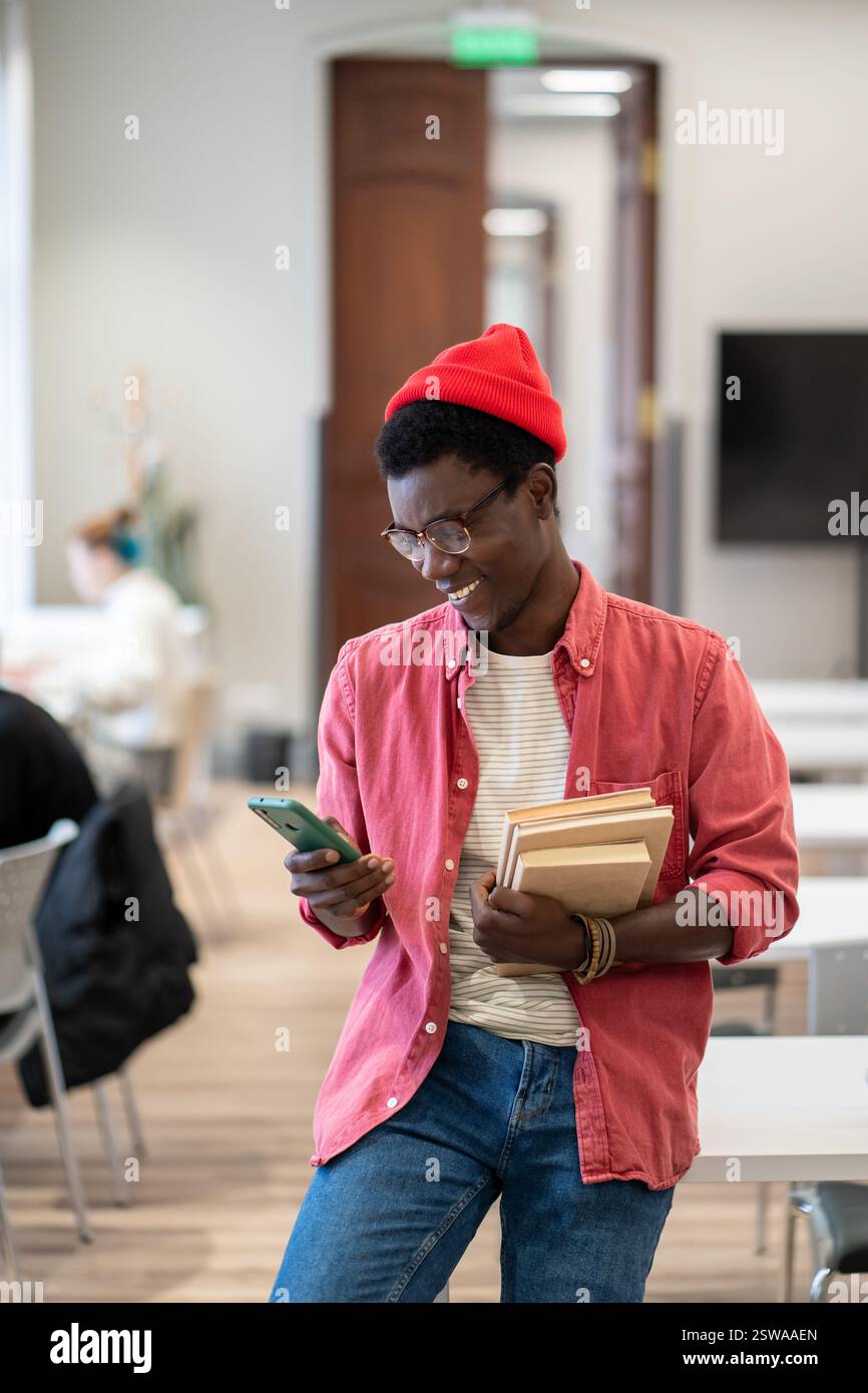 Black man studying in library hi-res stock photography and images - Alamy