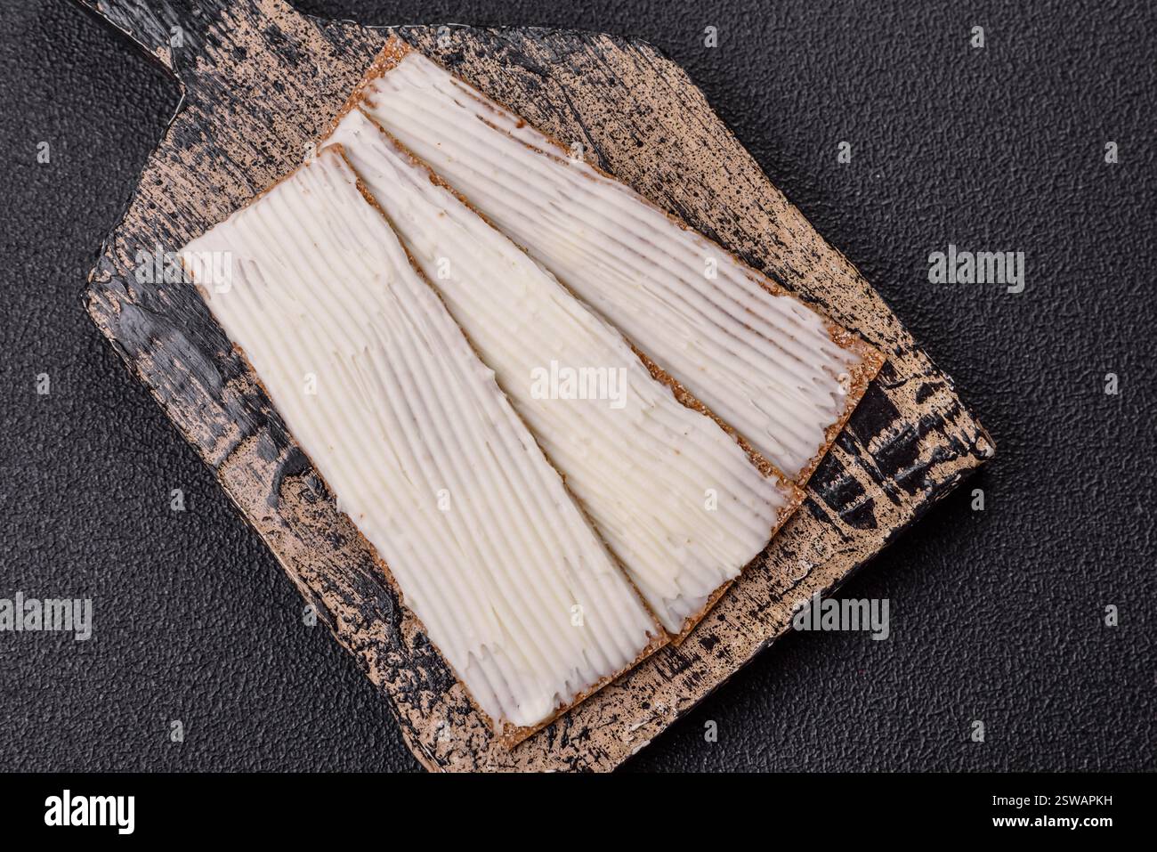 Rectangular whole grain crisp bread with cream cheese Stock Photo - Alamy