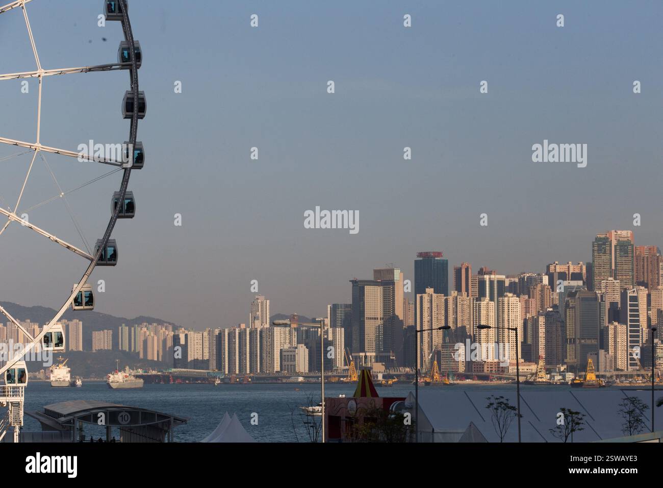 Hong Kong's iconic Ferris wheel overlooks the city skyline, with ...