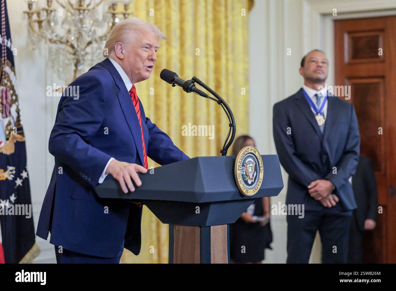 US President Donald J. Trump delivers remarks while standing with