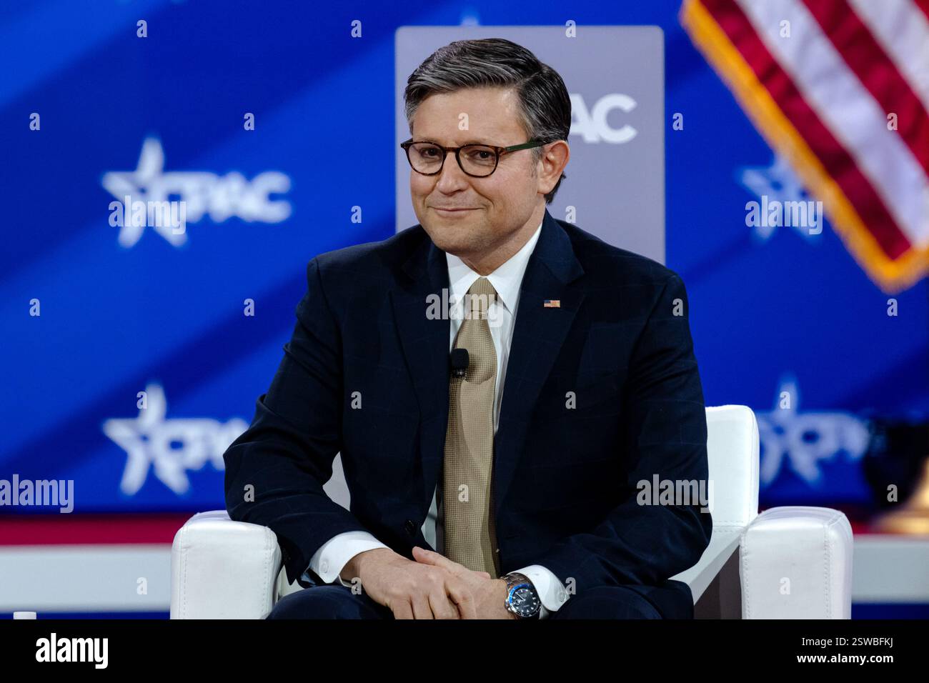 Speaker of the House, Mike Johnson speaks on day 1 of CPAC 25, in