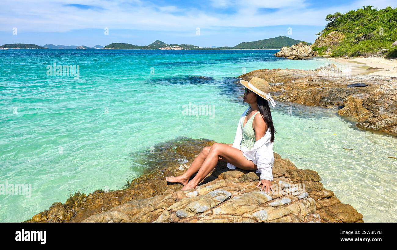 Relaxing by the turquoise waters of Samae San Island in Thailand on a ...