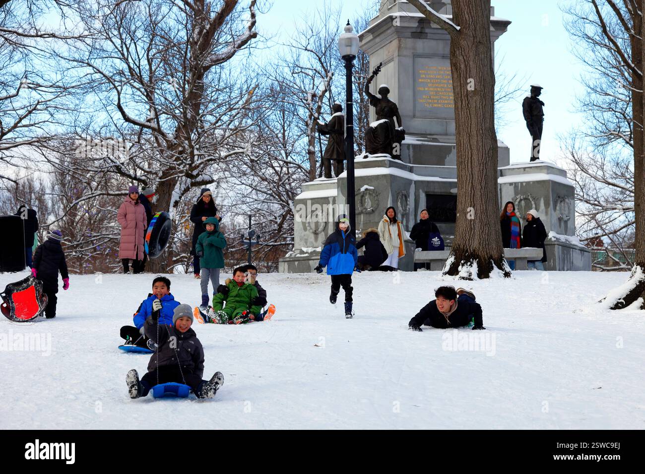 Kids sledding on Boston Commons, sledding down Flagstaff Hill, Boston ...