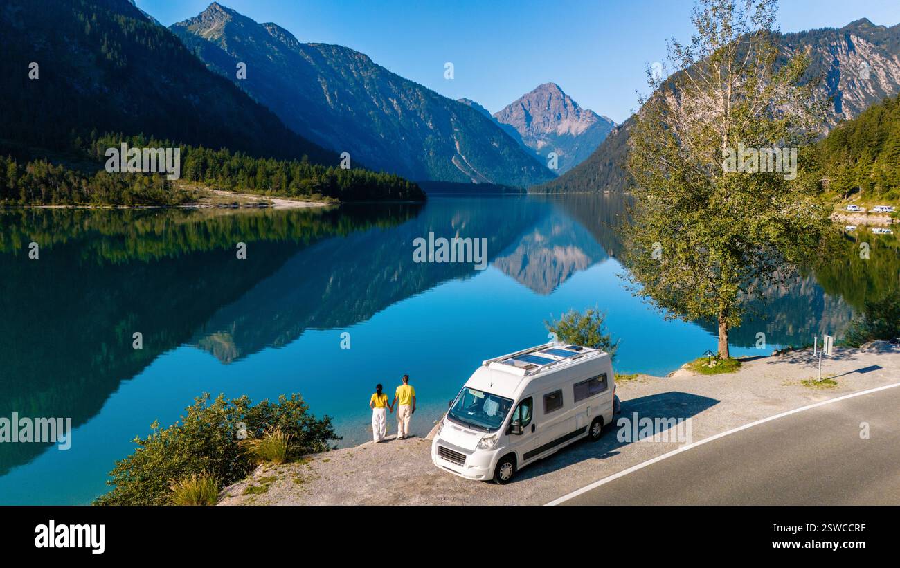 Exploring the tranquil shores of Plansee, Austria, with mountain Stock Photo