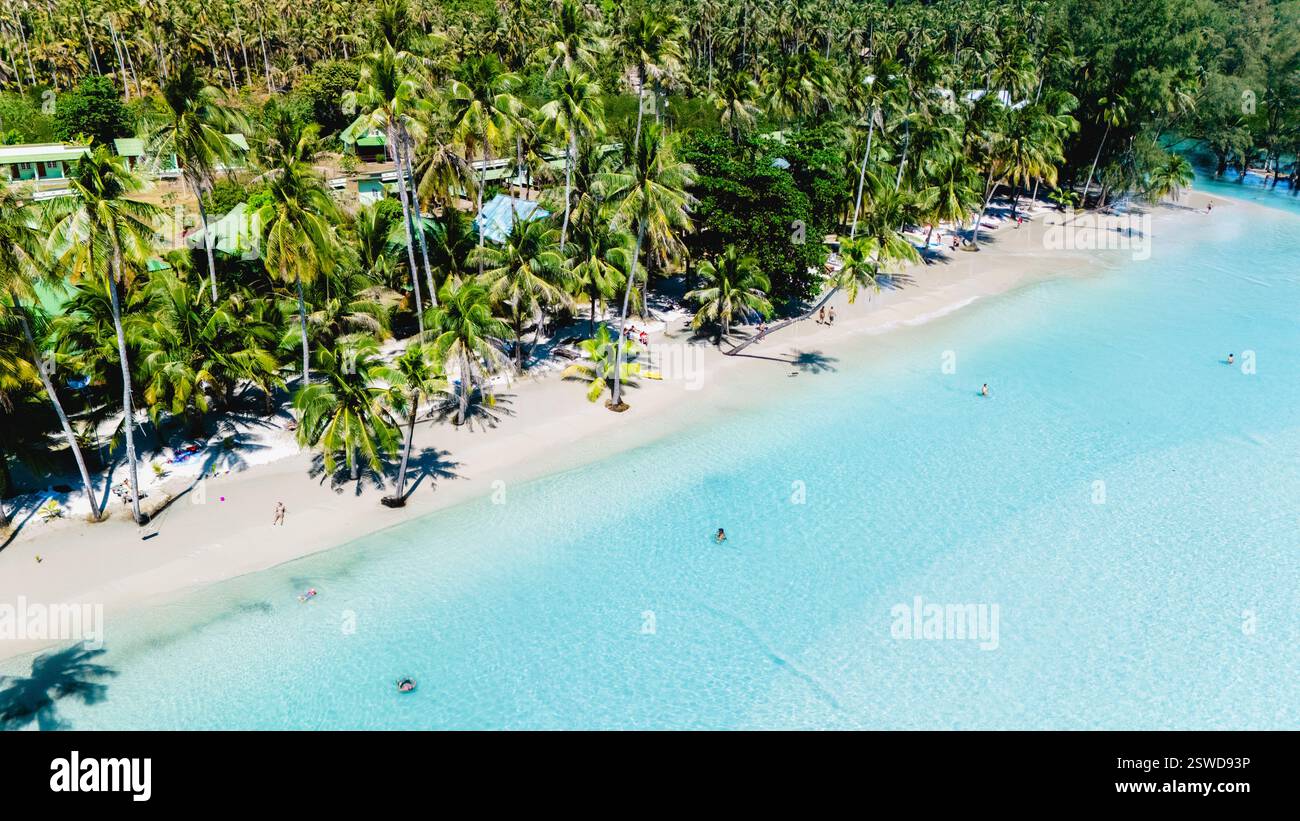 Stunning view of Koh Kood's tranquil beaches surrounded by lush palm ...