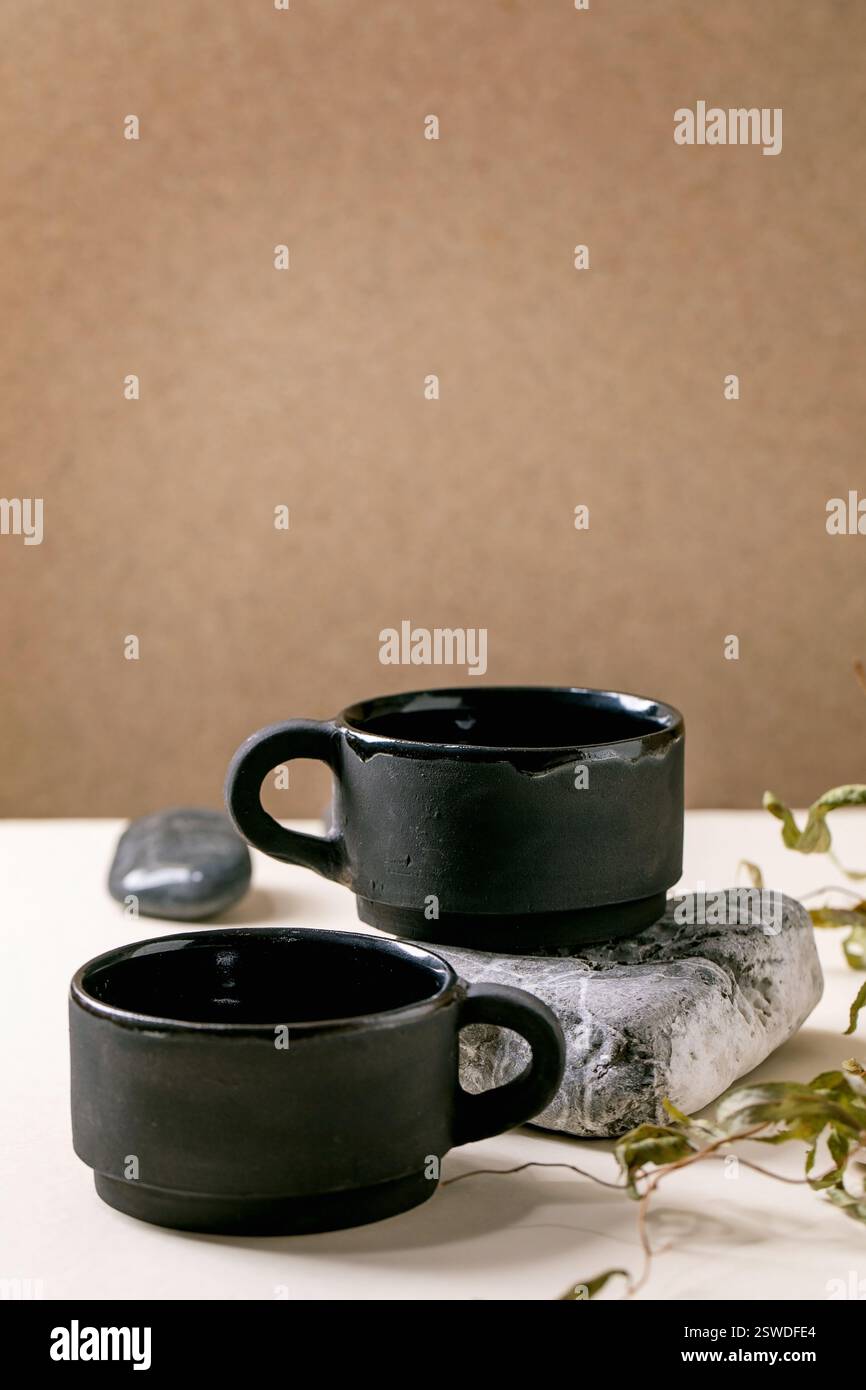 Set of empty grey ceramic cups Stock Photo