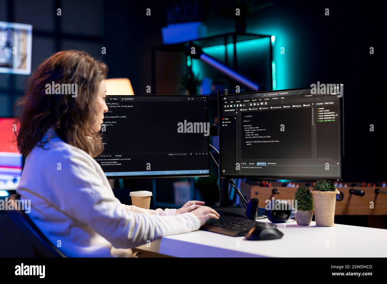 Freelancing computer scientist securing company servers from virus attacks to avoid unwanted failures. IT remote worker writing code to build firewalls protecting data from risks Stock Photo