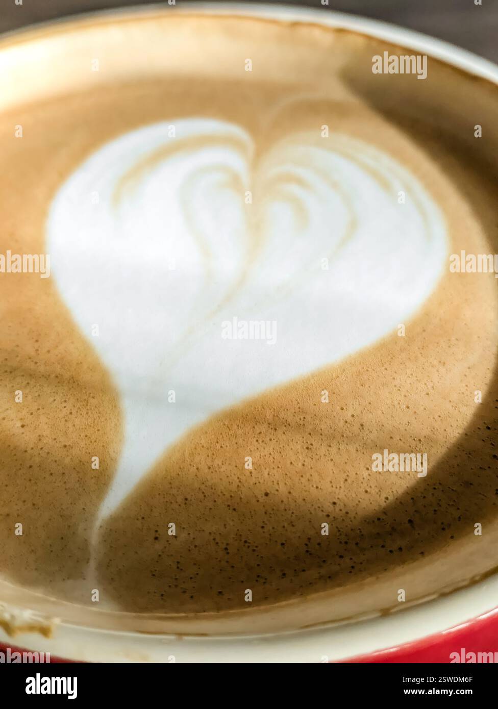Hot cappuccino coffee with a heart pattern on the foam Stock Photo - Alamy