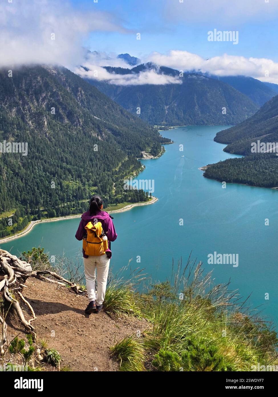 Exploring the serene beauty of Plansee in Austria during golden hour Stock Photo