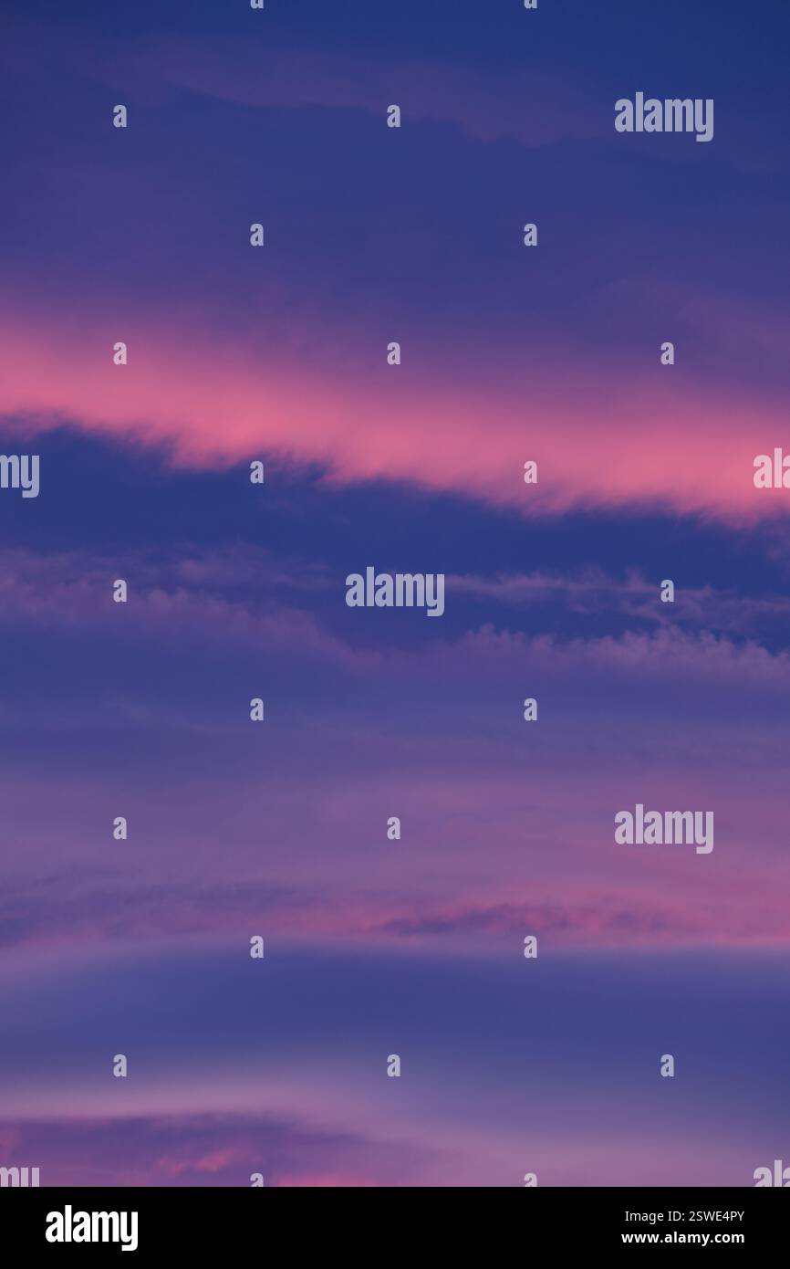 Pastel sunset hues paint the evening sky with soft pink and purple ...