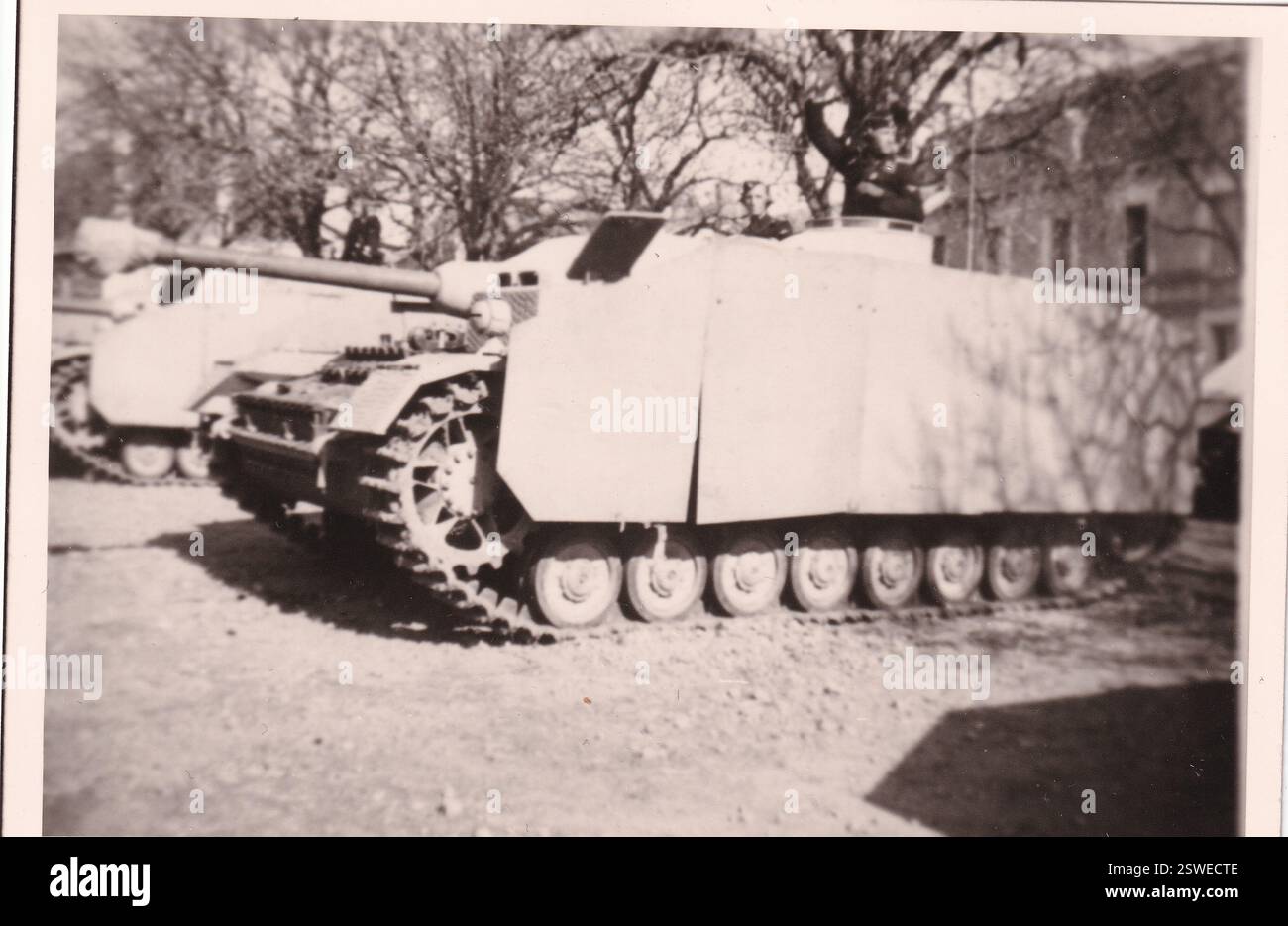 World War Two B&W photo A German Sturmgeschütz lV with Side Armour Skirting in France 1944 . The Assault Gun belongs to the 17th SS Panzer Division 'Gotz von Berlichingen' Stock Photo