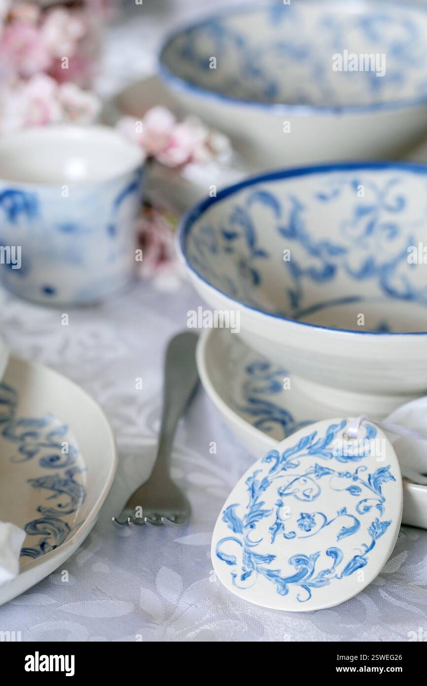 Easter table setting with empty craft ceramic tableware Stock Photo