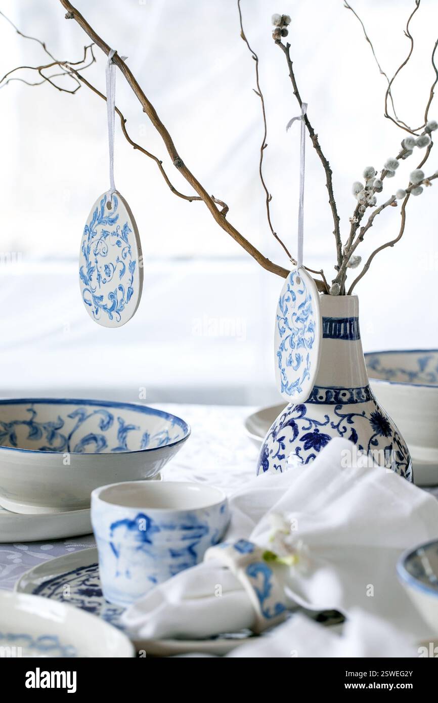 Easter table setting with empty craft ceramic tableware Stock Photo