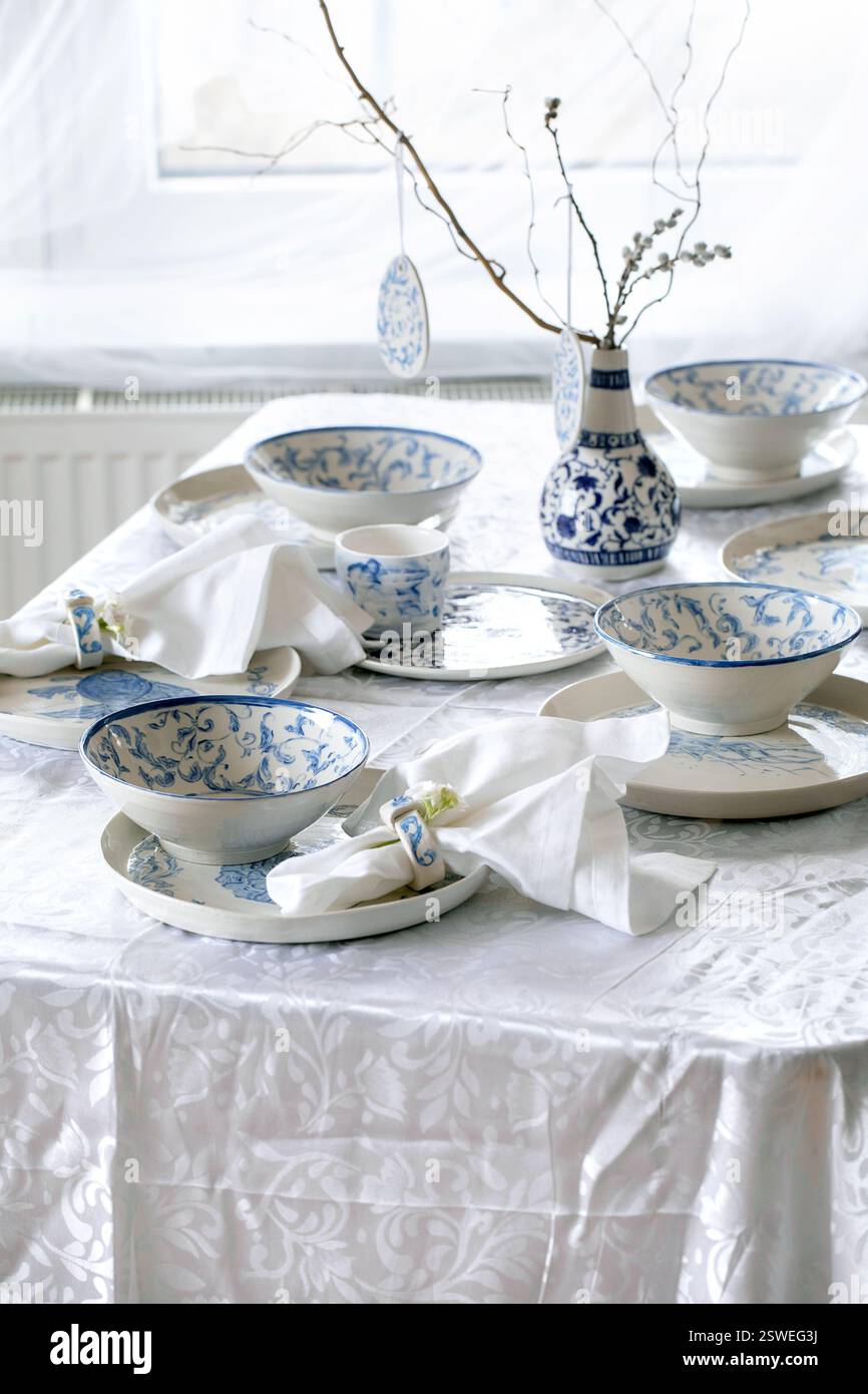 Easter table setting with empty craft ceramic tableware Stock Photo