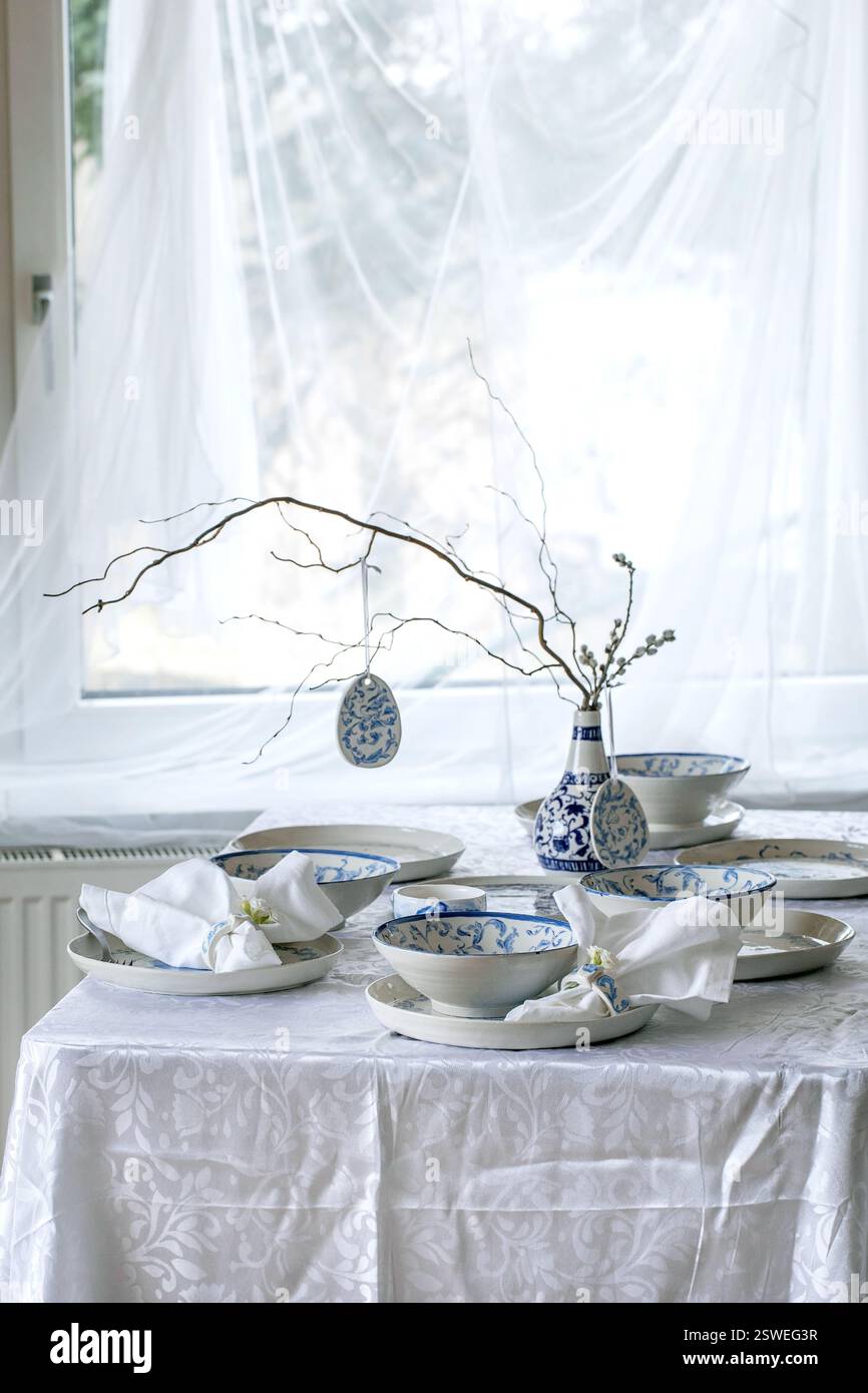 Easter table setting with empty craft ceramic tableware Stock Photo