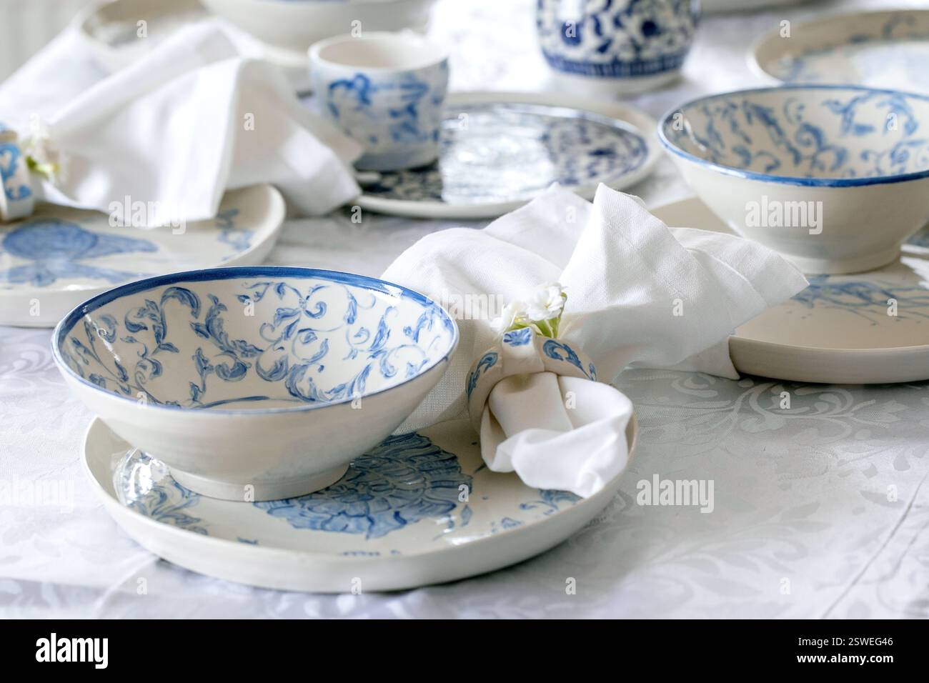 Easter table setting with empty craft ceramic tableware Stock Photo