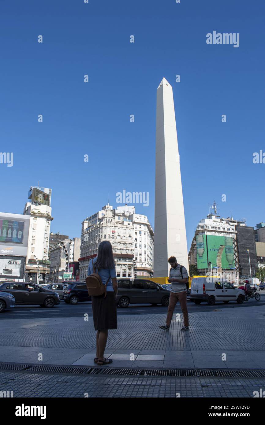 Tourist admiring the obelisk, the landmark in the centre of Buenos ...