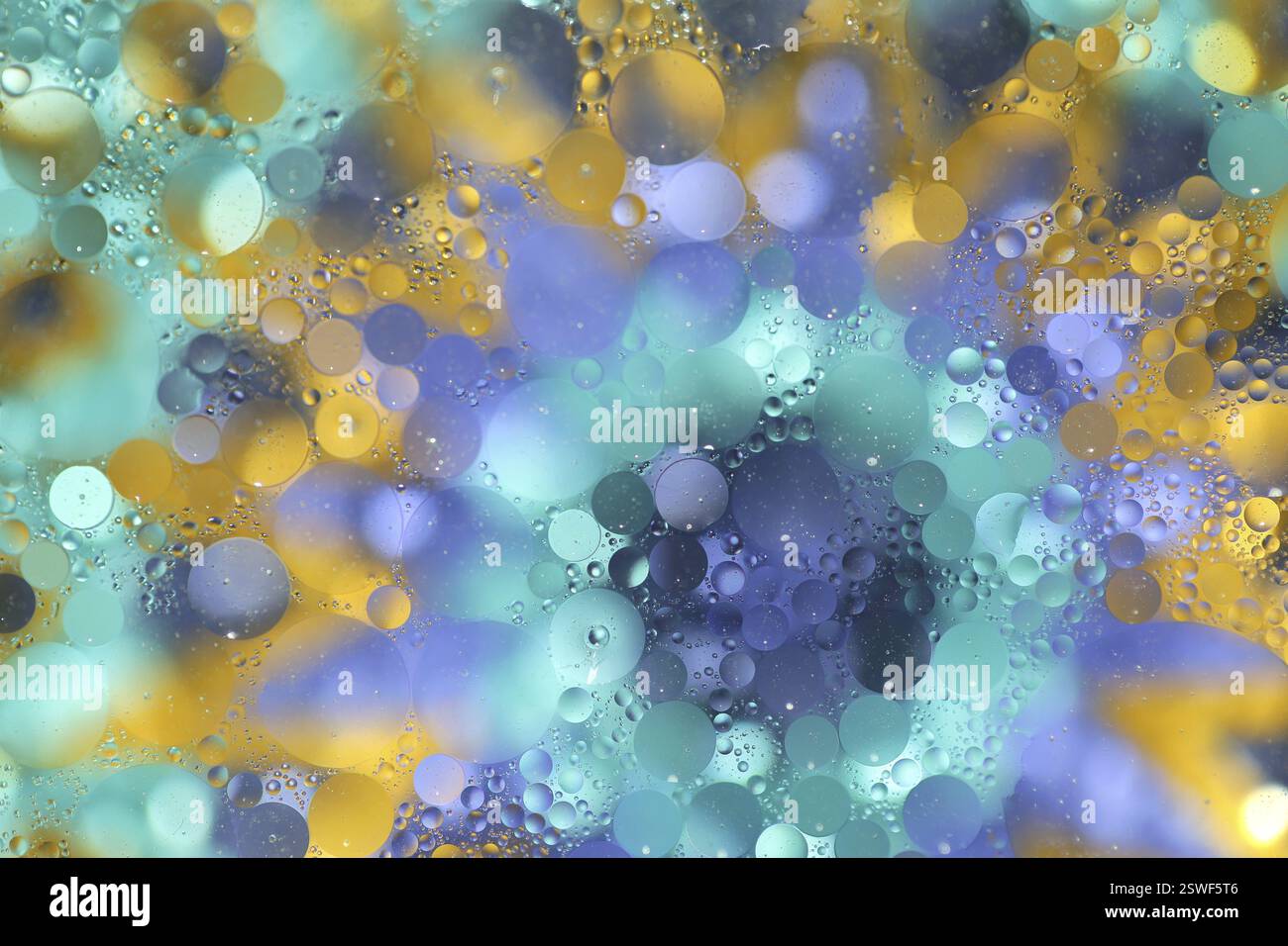 Oil on water over colourful background, pattern Stock Photo - Alamy