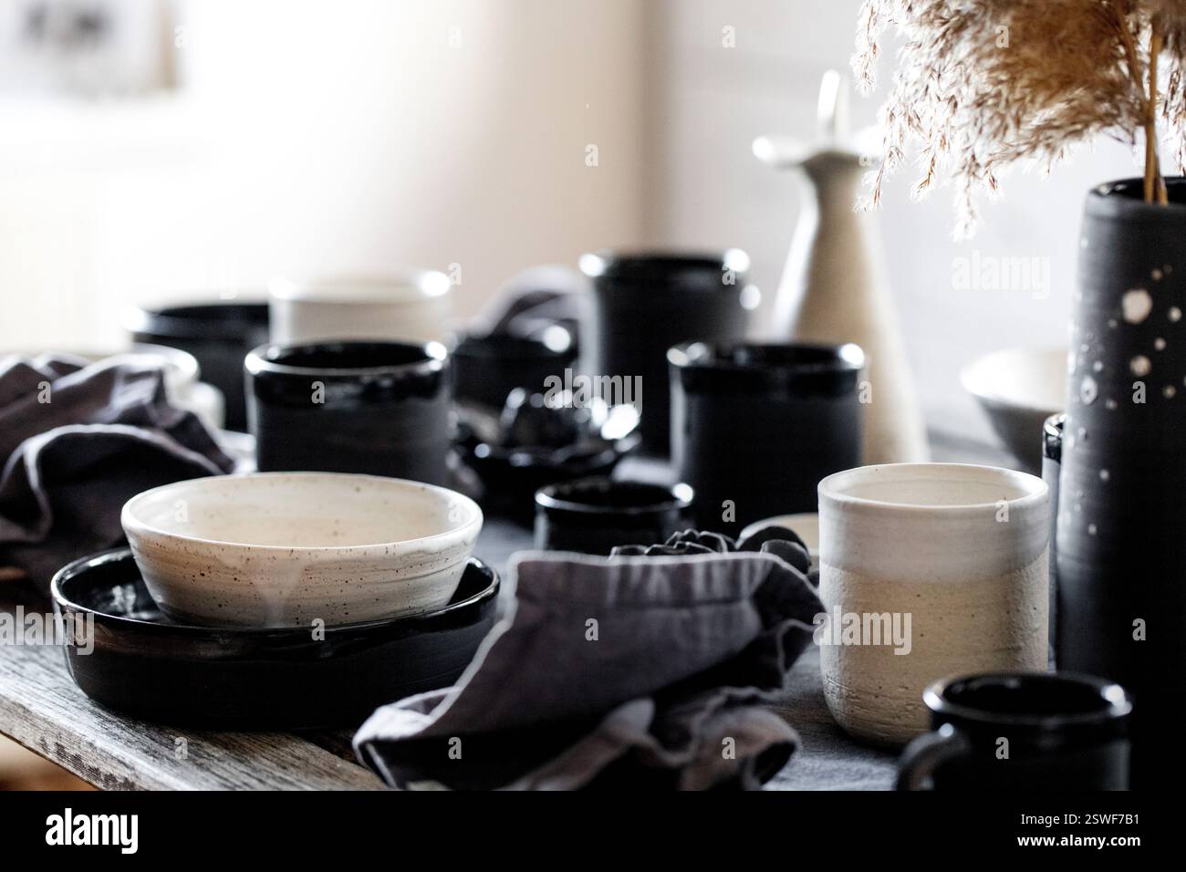 Rustic table setting with empty craft handmade ceramic tableware Stock Photo