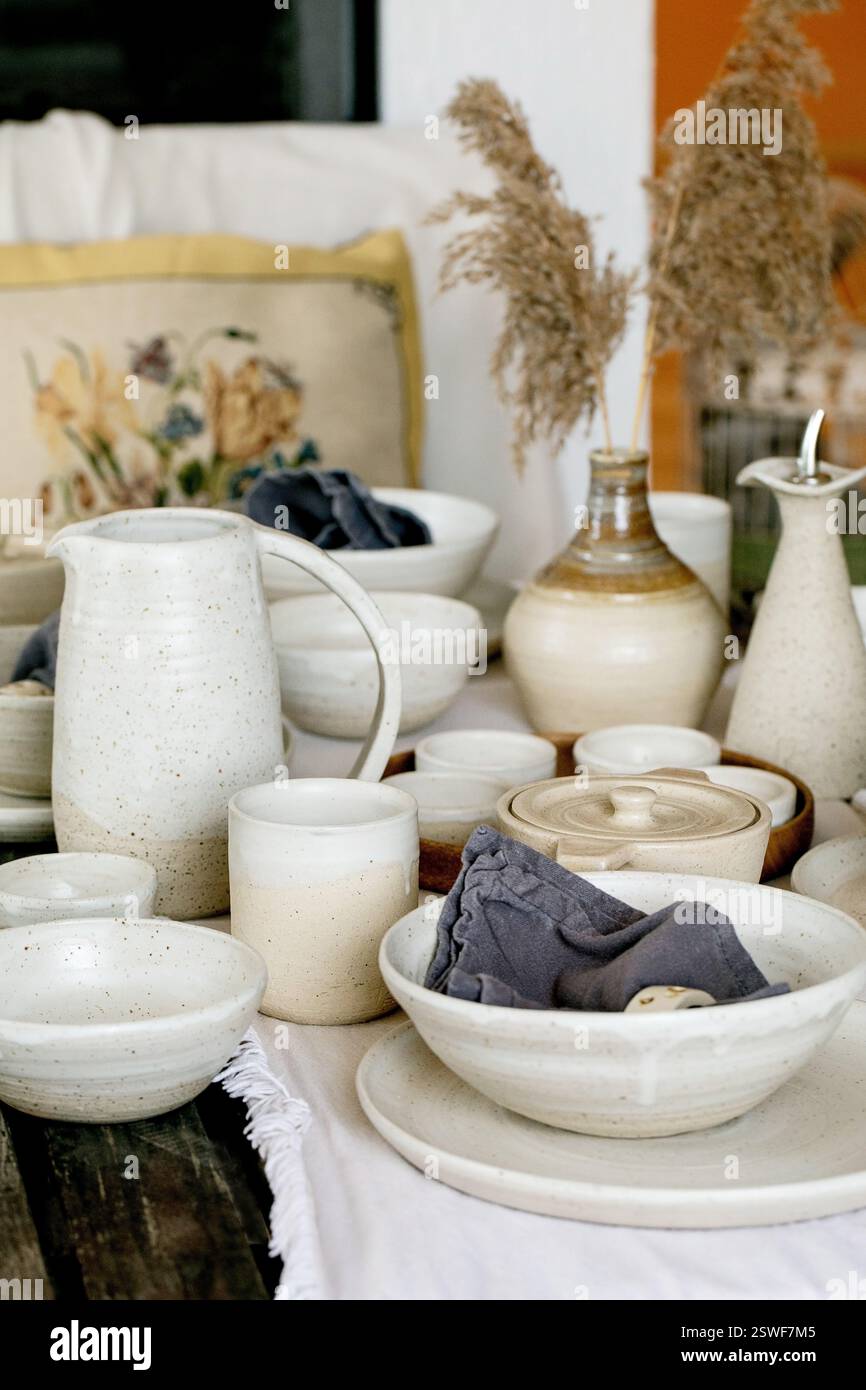 Rustic table setting with empty craft handmade ceramic tableware Stock Photo