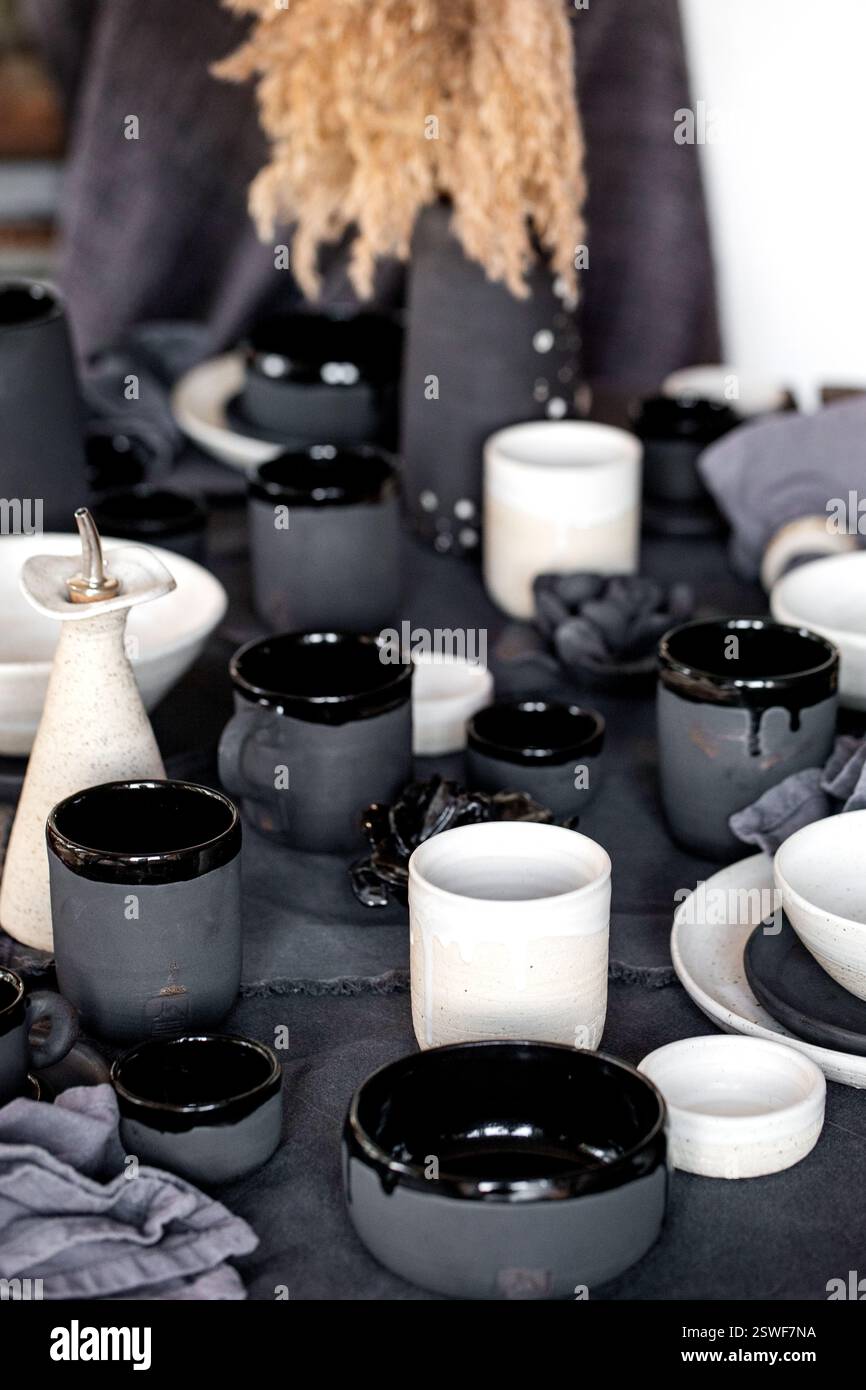 Rustic table setting with empty craft handmade ceramic tableware Stock Photo