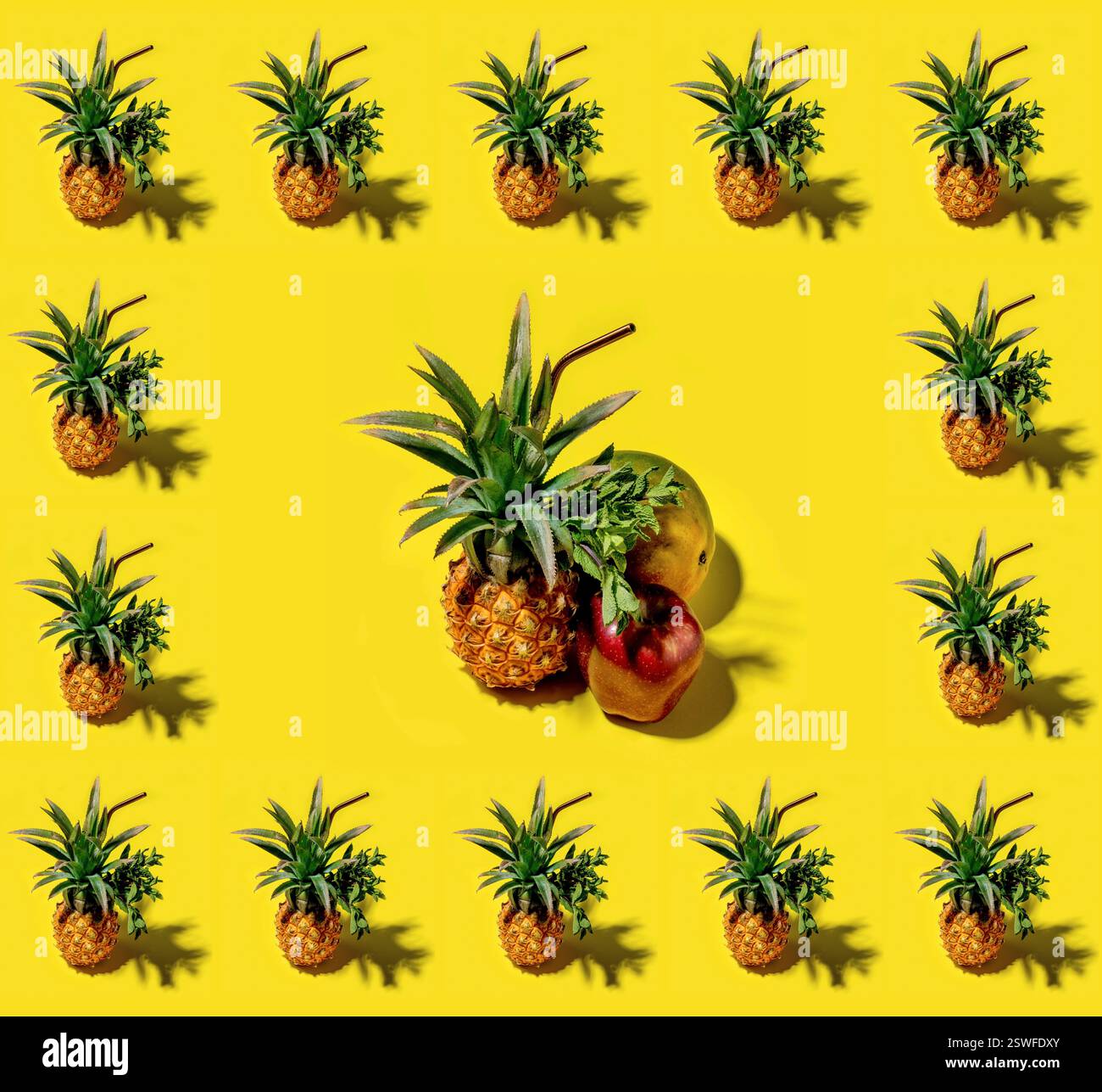 Many pineapples on a solid yellow background pattern Stock Photo