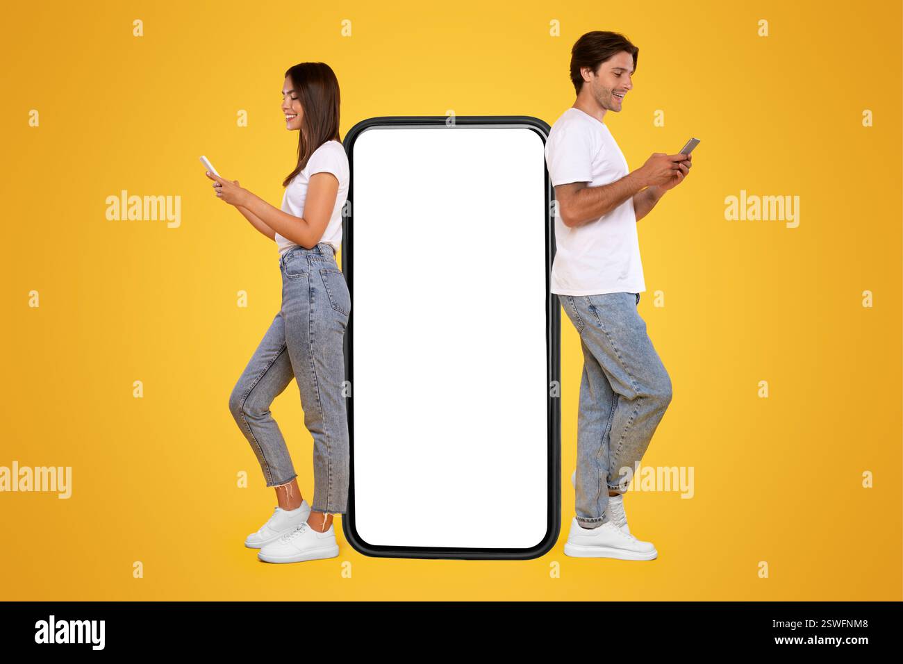 Couple leaning on white empty smartphone screen and using phone Stock Photo