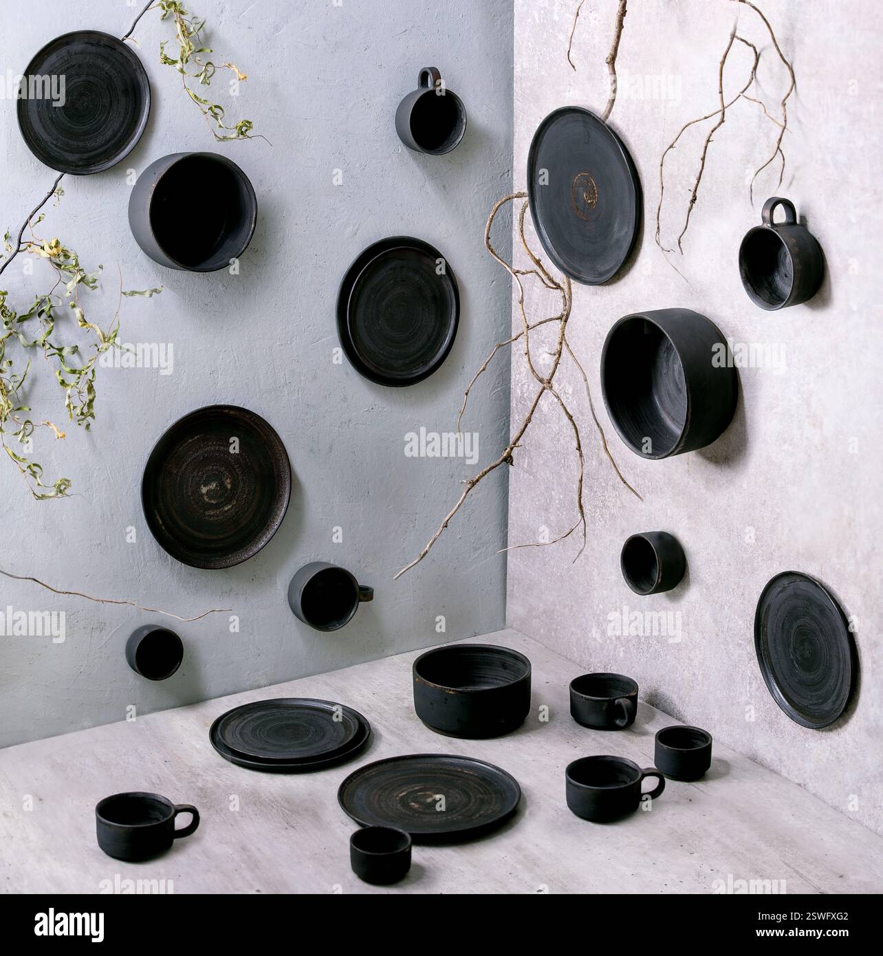 Set of empty black handcrafted ceramic plates Stock Photo