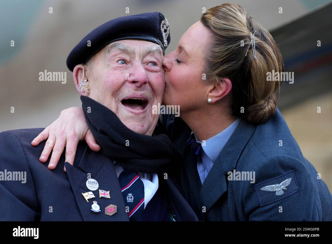 Henry Rice, a 98 year-old Normandy veteran, gets a kiss from Katie ...