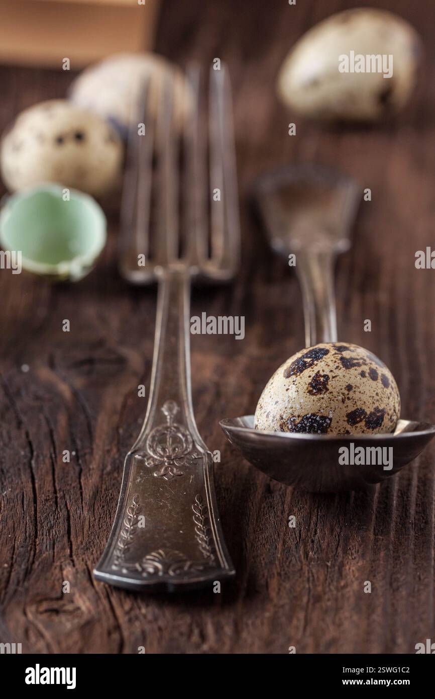 Easter table setting with quail eggs Stock Photo