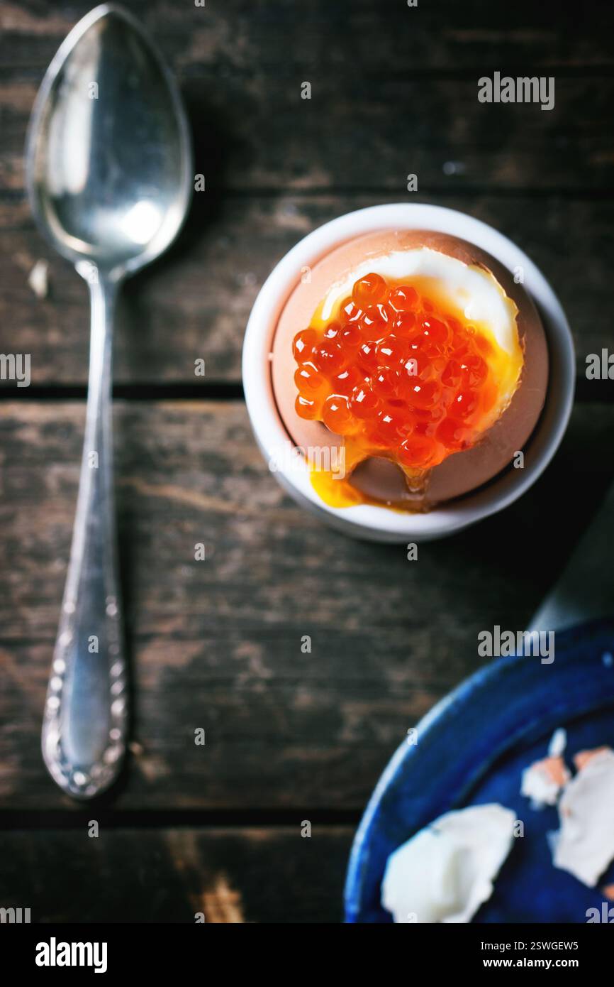 Soft-boiled egg with red caviar Stock Photo