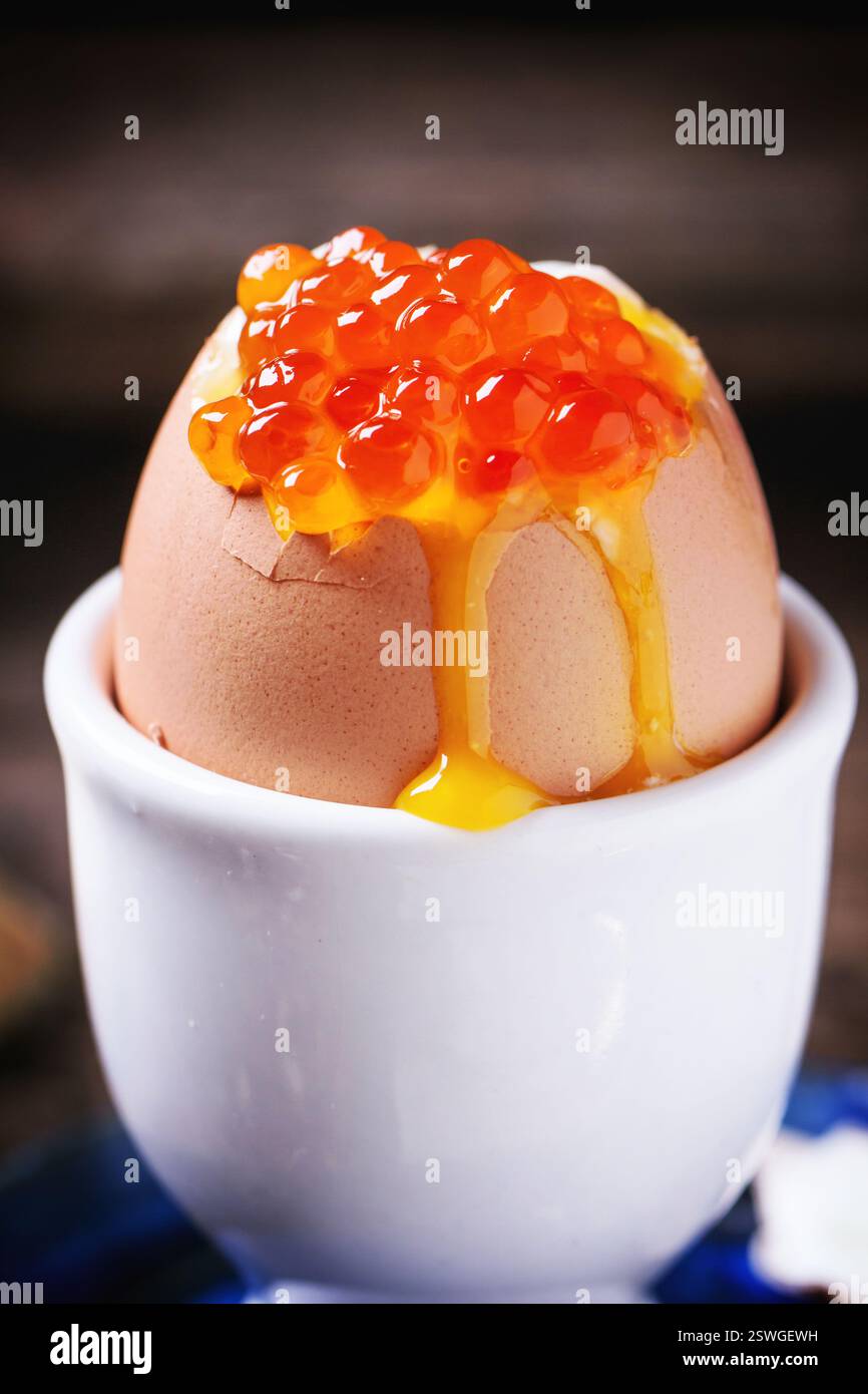 Soft-boiled egg with red caviar Stock Photo