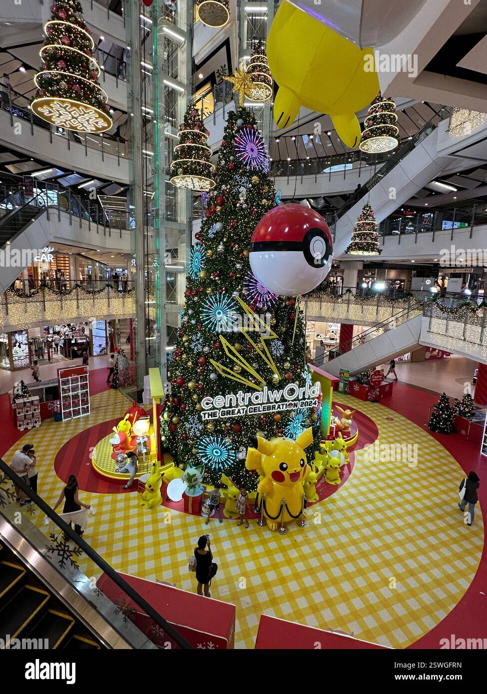 Bangkok, Thailand - Jan 3, 2024: Inside the centralworld shopping mall in Bangkok featuring a large Christmas tree. - Smartphone Captured Stock Image